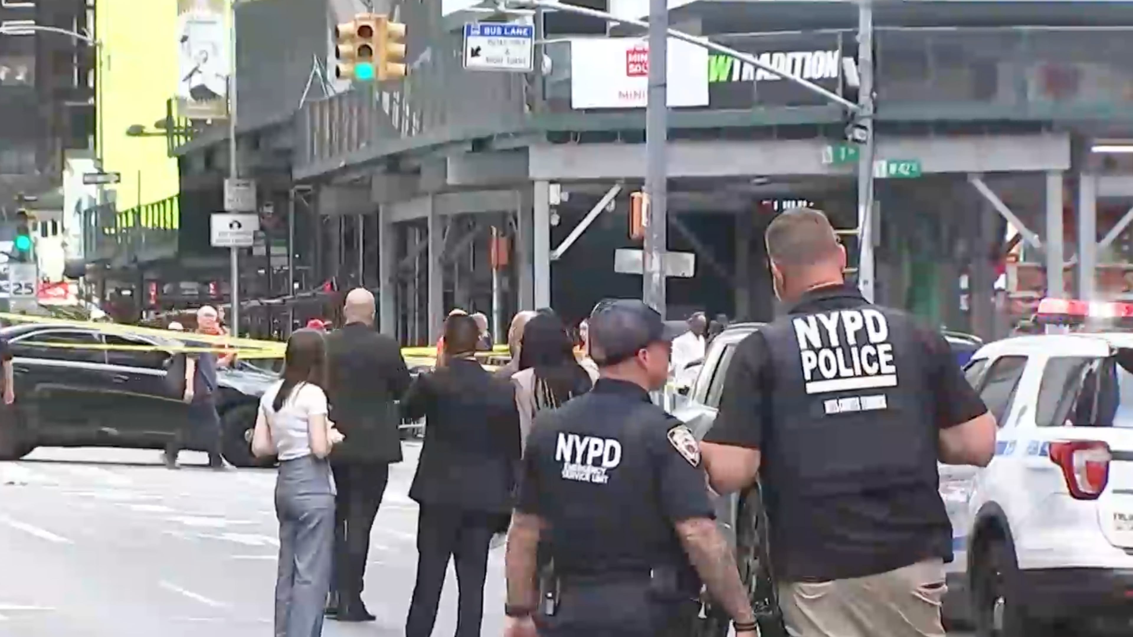 This image made from video provided by WABC shows NYPD officers on the scene after a woman brandishing two large knives was shot by officers in Times Square in New York, Monday, Aug. 31, 2026. (WABC via AP)