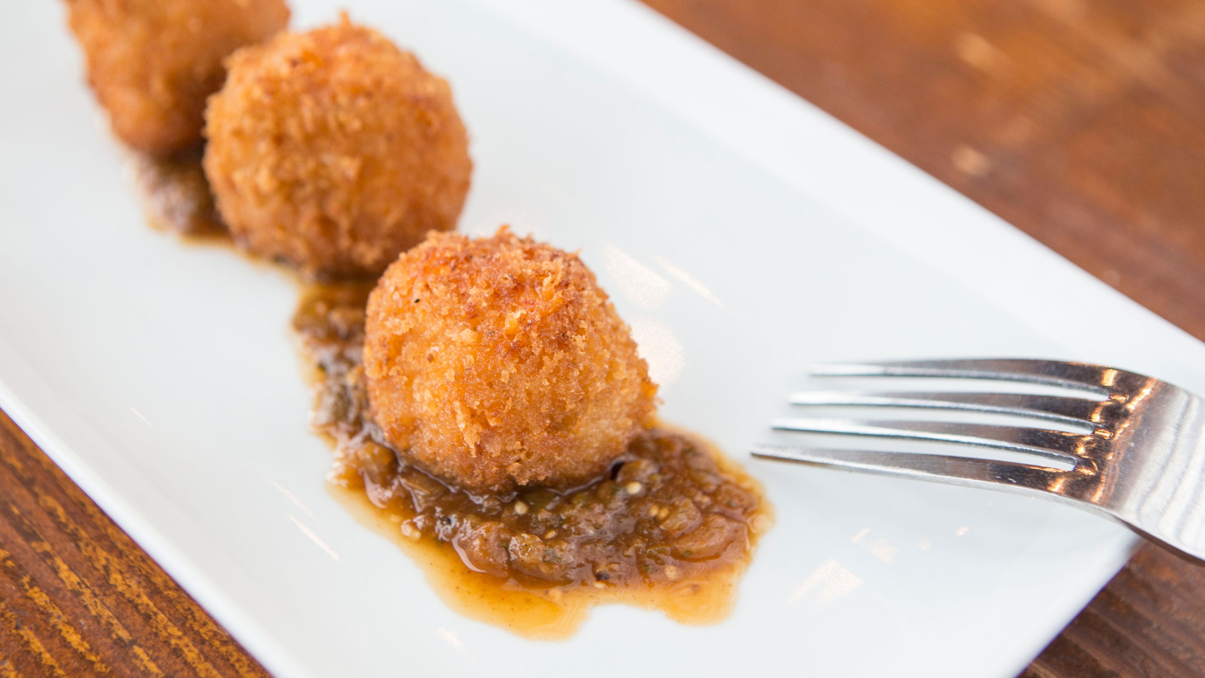 Kids eat free and adults can order two-for-one appetizers at Wahoo! Grill. Photo credit: Emily Cameron.