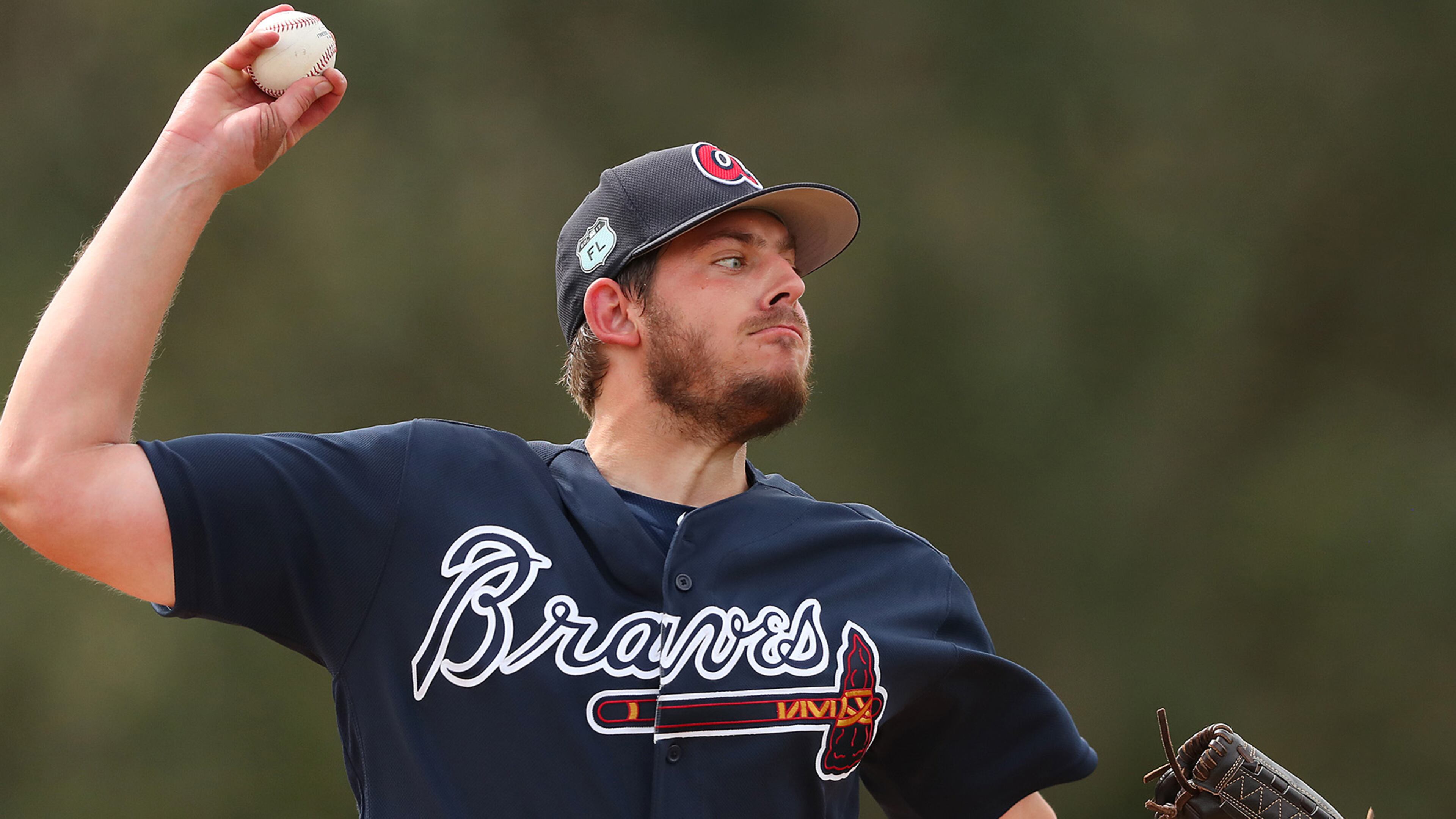 Braves pitcher Aaron Blair delivers a pitch while the Braves throw live batting practice for the first time during spring training on Tuesday Feb. 21, 2017, at the ESPN Wide World of Sports in Lake Buena Vista. Curtis Compton/ccompton@ajc.com