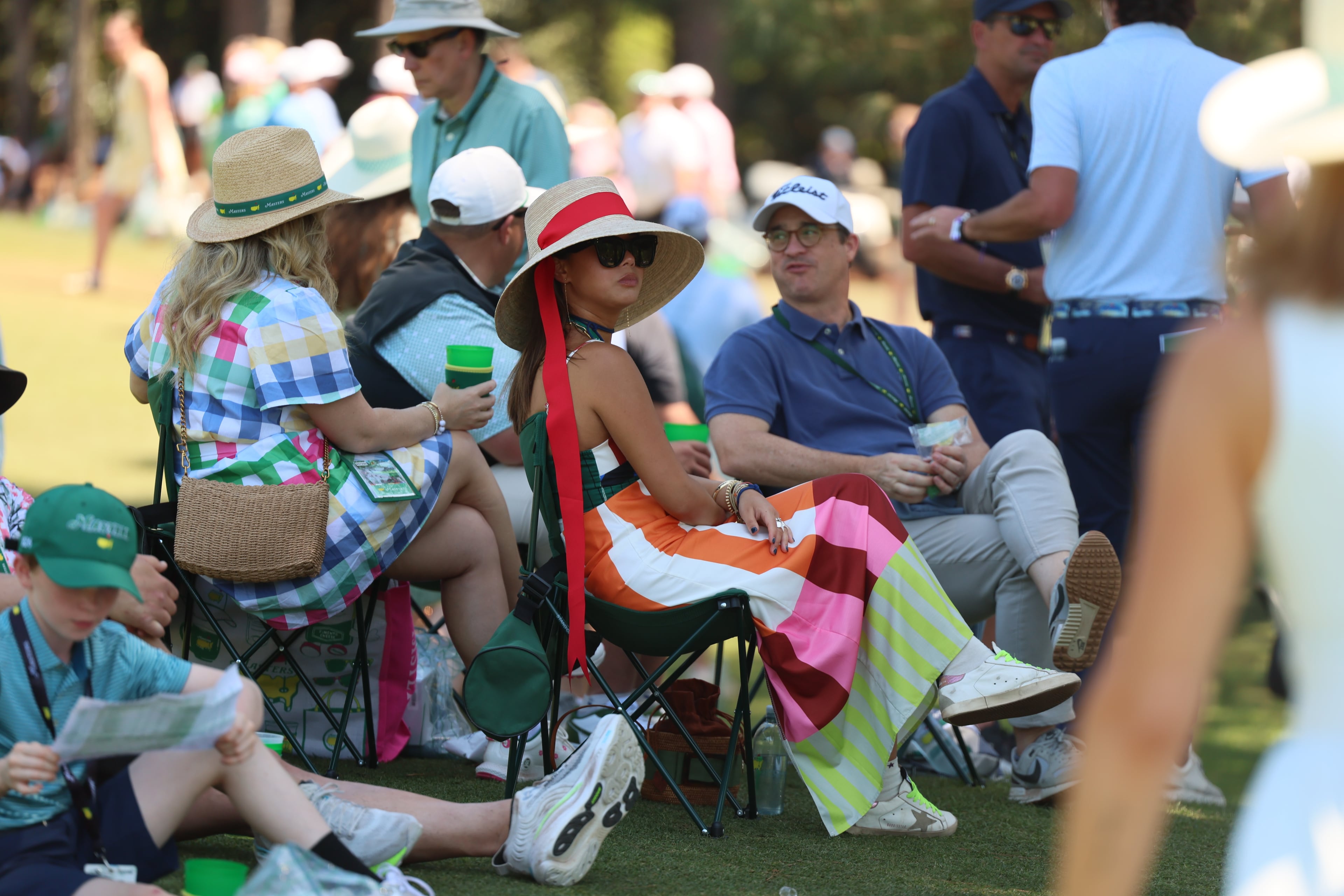 Colorfully dressed patrons on 144th green during third round of the Masters, at Augusta National Golf Club, Saturday, April 11, 2026, in Augusta, GA (Jason Getz/AJC)