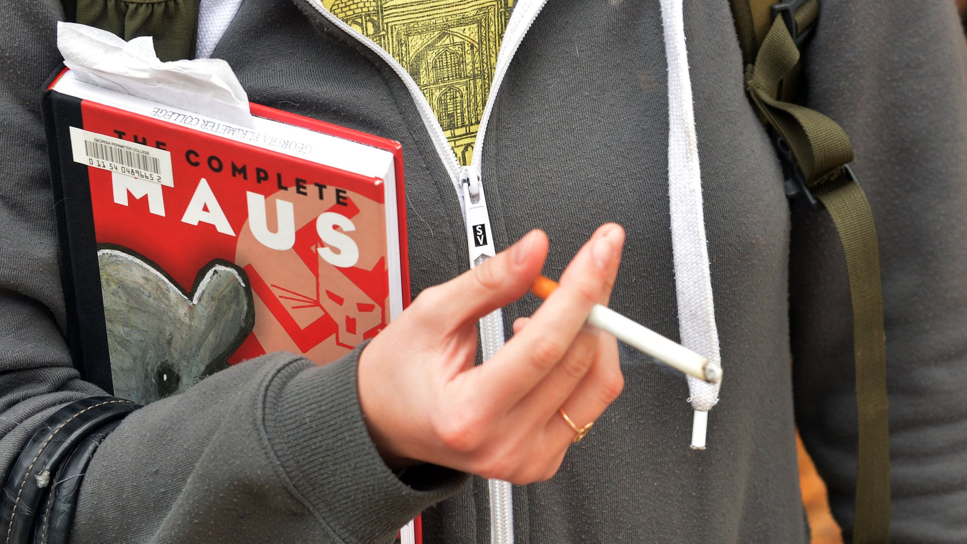 Students at Georgia Perimeter College’s Clarkston campus smoke in an area just across the walkway from the school cafeteria. KENT D. JOHNSON / KDJOHNSON@AJC.COM