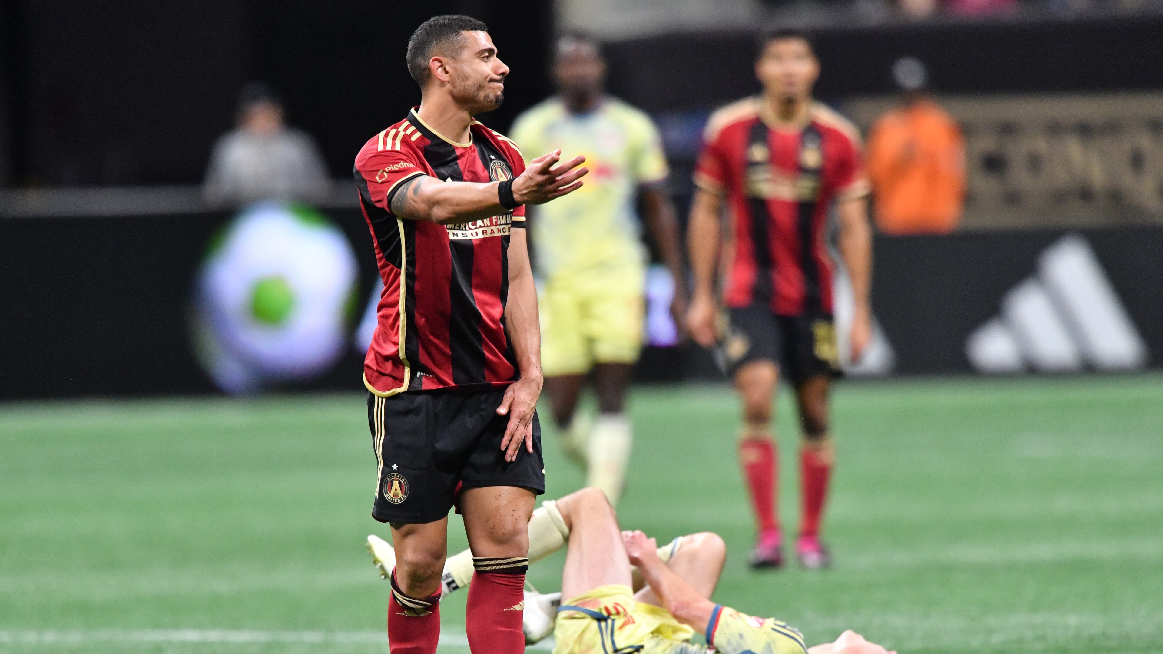 Atlanta United's forward Giorgos Giakoumakis reacts after he fouled New York Red Bulls' midfielder Peter Stroud (on the field) during the second half in a MLS soccer match at Mercedes-Benz Stadium, Saturday, April 1, 2023, in Atlanta. Atlanta United won 1-0 over New York Red Bulls. (Hyosub Shin / Hyosub.Shin@ajc.com)