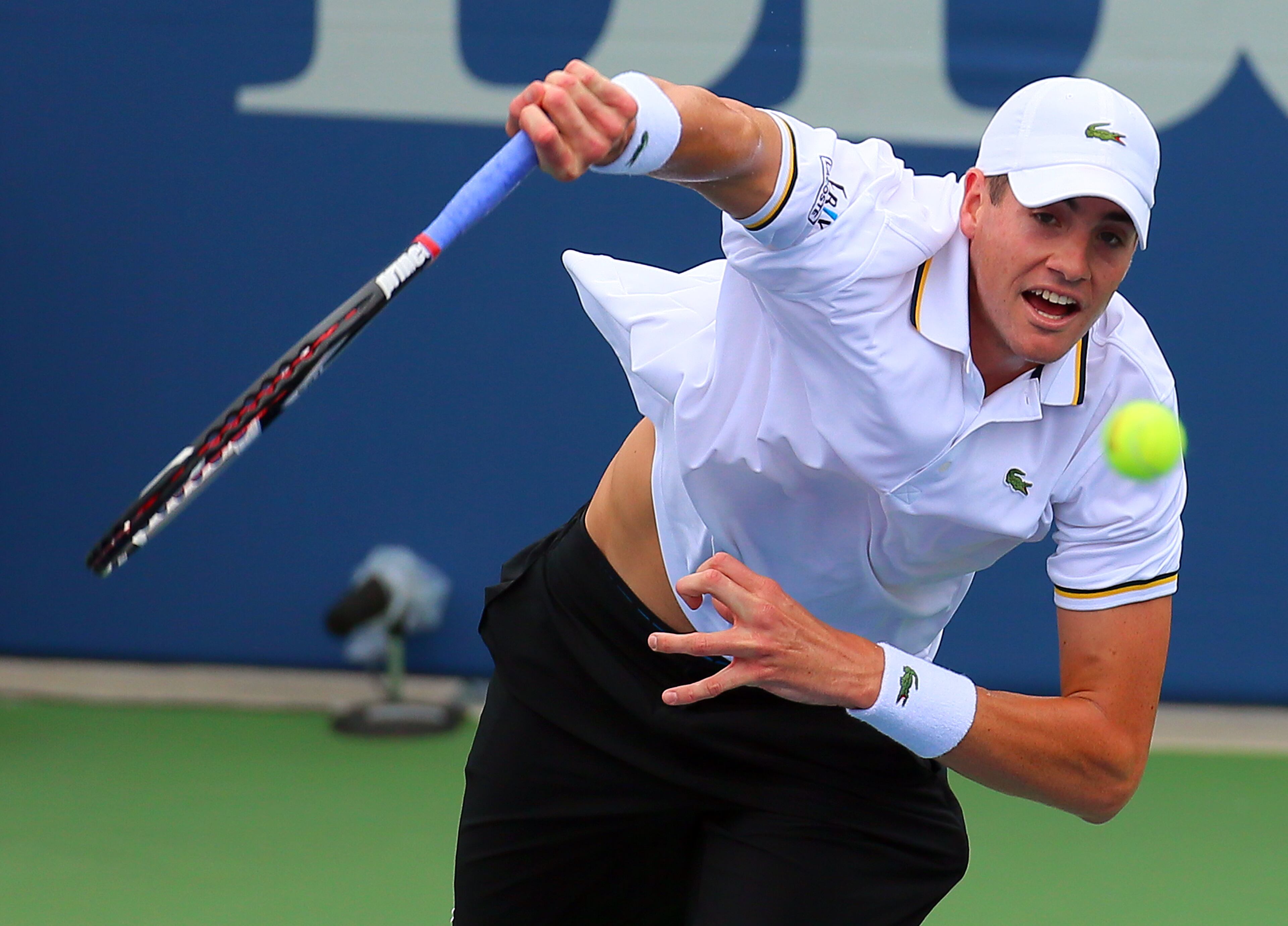 John Isner serves an ace to Lleyton Hewitt in their semi-finals match at the BB&T Atlanta Open on Saturday, July 27, 2013, in Atlanta. CURTIS COMPTON / CCOMPTON@AJC.COM
