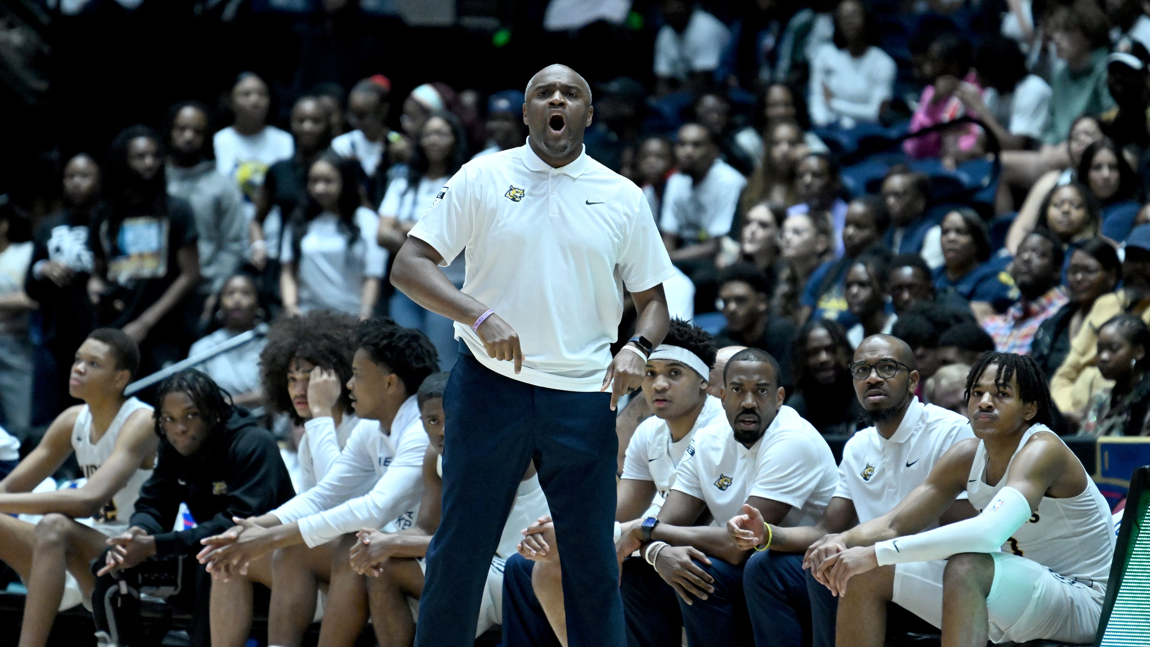 Coach Larry Thompson — pictured shouting instructions during the Class 6A championship game in March — and defending state champion Wheeler remain No. 1 in the 6A standings this season. The Wildcats are No. 16 in MaxPreps’ national rankings. (Hyosub Shin/AJC 2025)