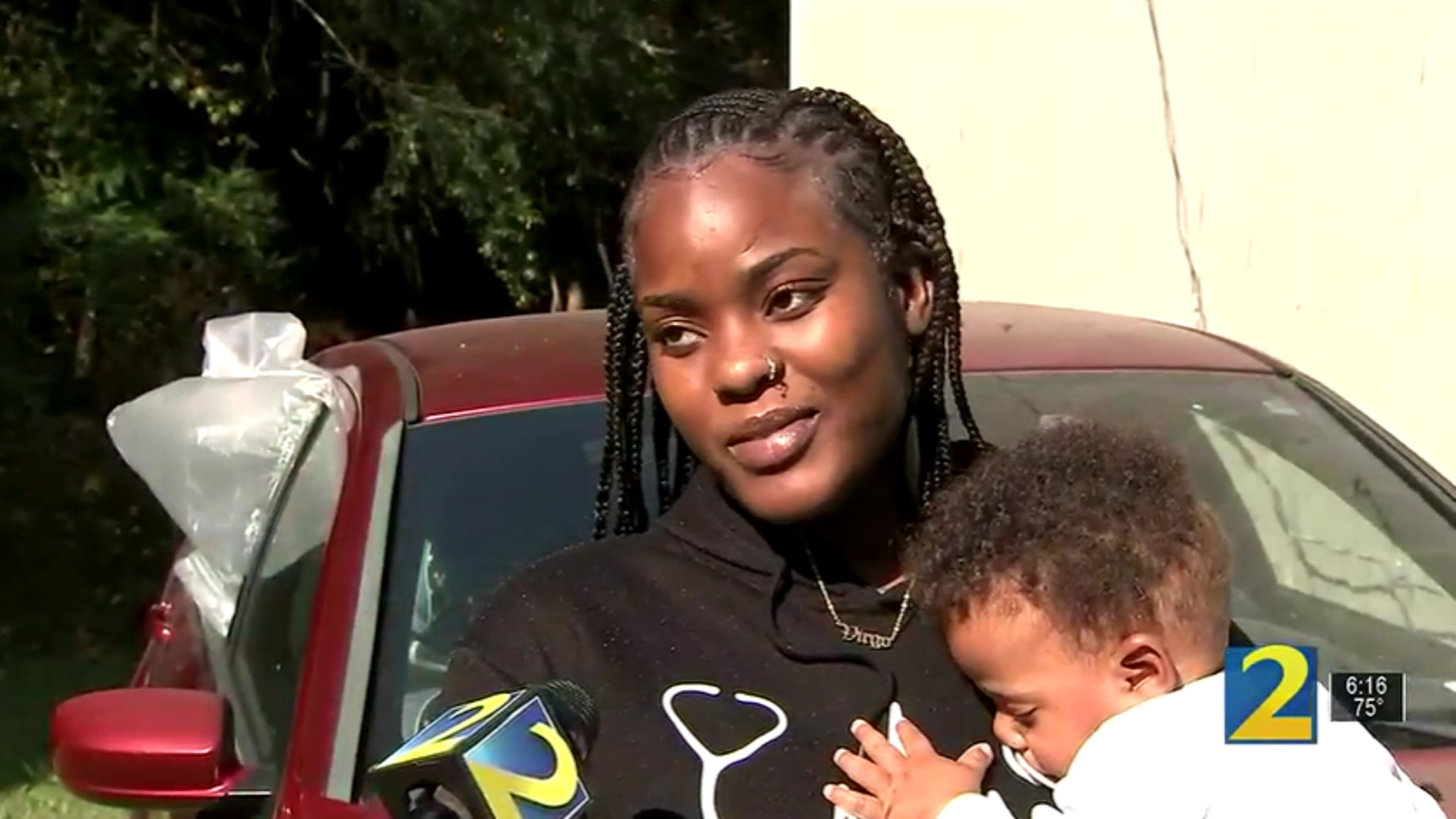 Jamia Ewing said she and her son had just arrived home when a black vehicle went by her driveway, and someone inside opened fire on her car. She and her son were unharmed.