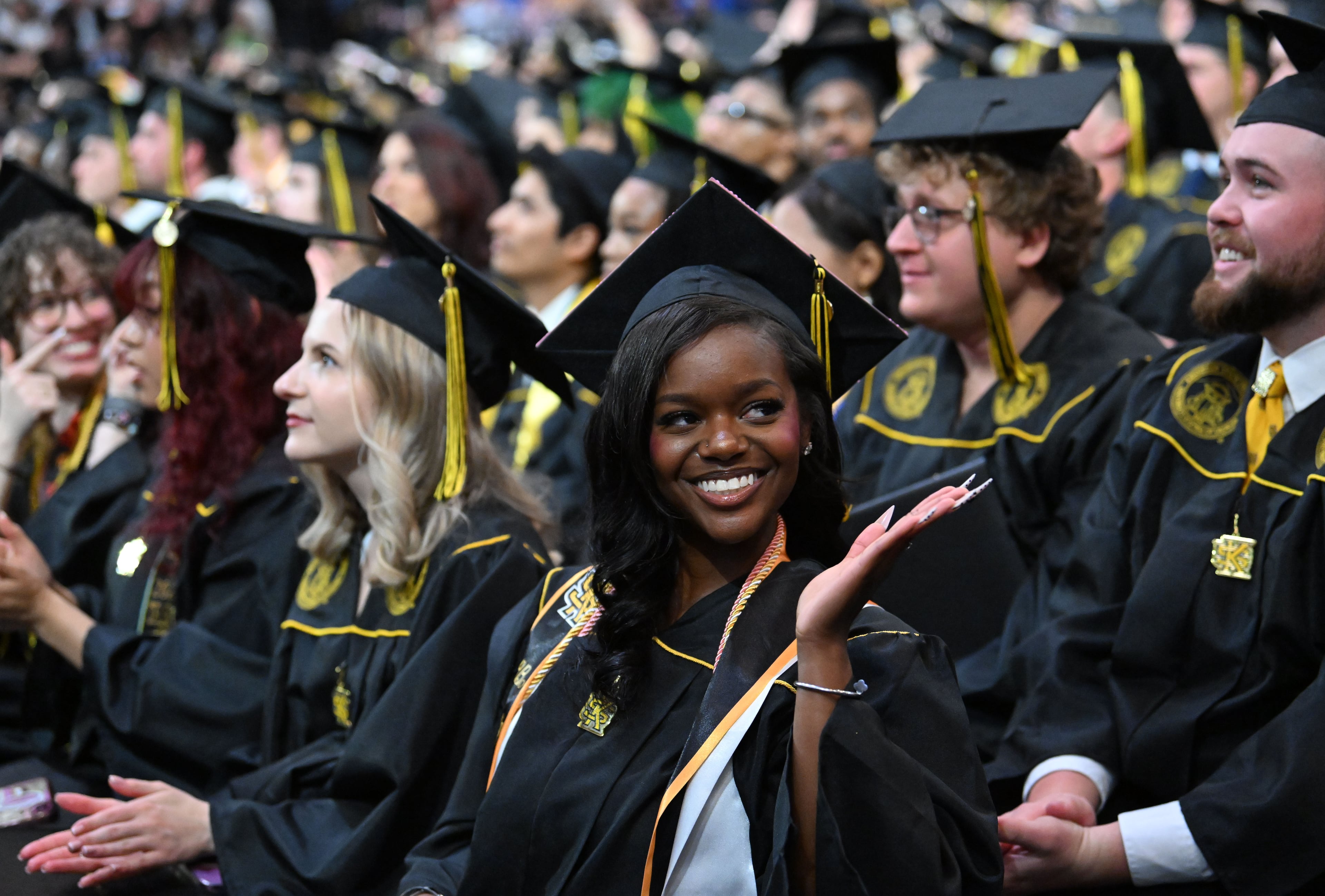 Graduates react during Kennesaw State University’s spring commencement Wednesday. (Hyosub Shin/AJC)