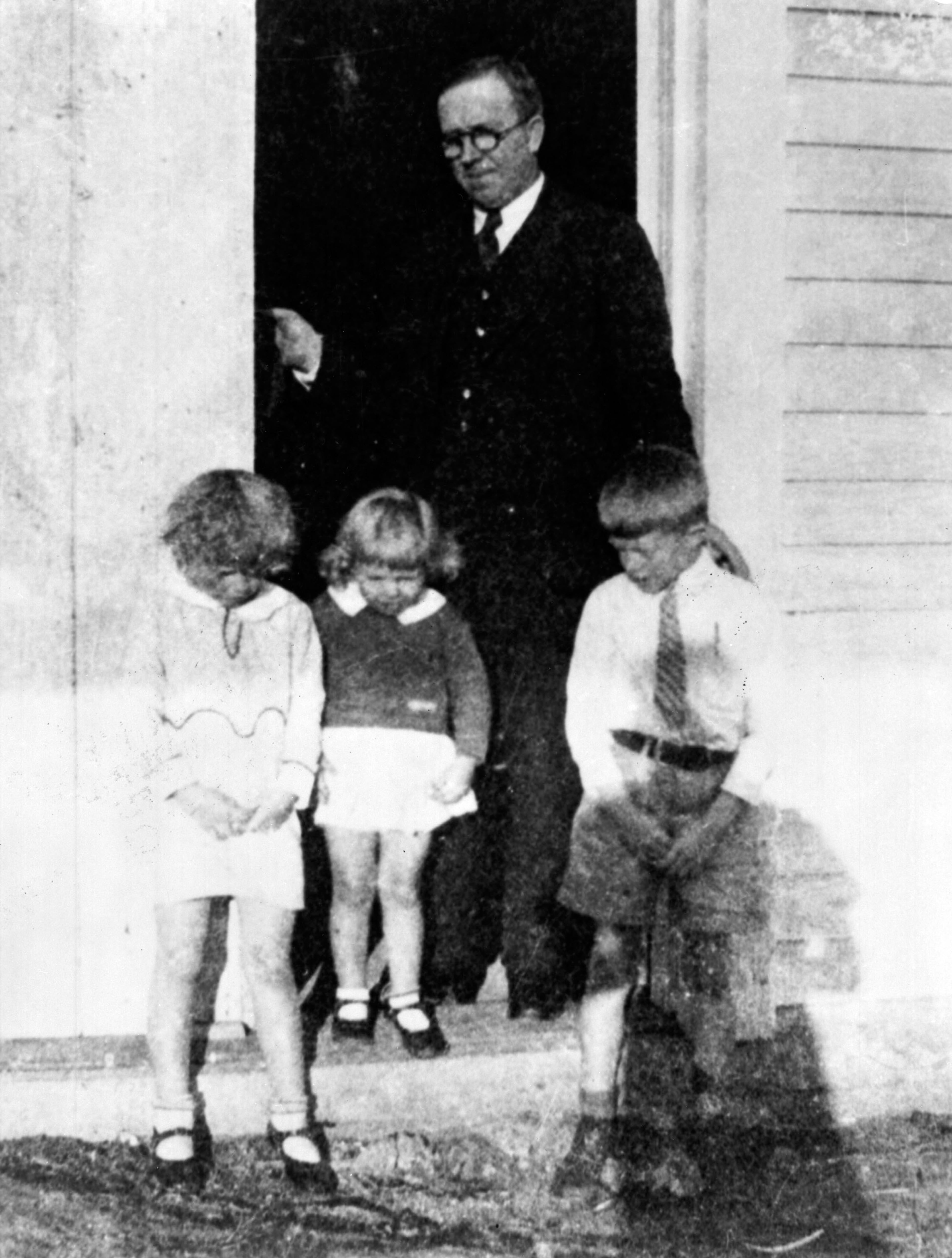 Earl Carter, Jimmy Carter's father, with three of his children, Ruth, Gloria, and Jimmy in this 1932 photo. Earl Carter was a prominent business owner in Plains, Ga. (Jimmy Carter Library)
