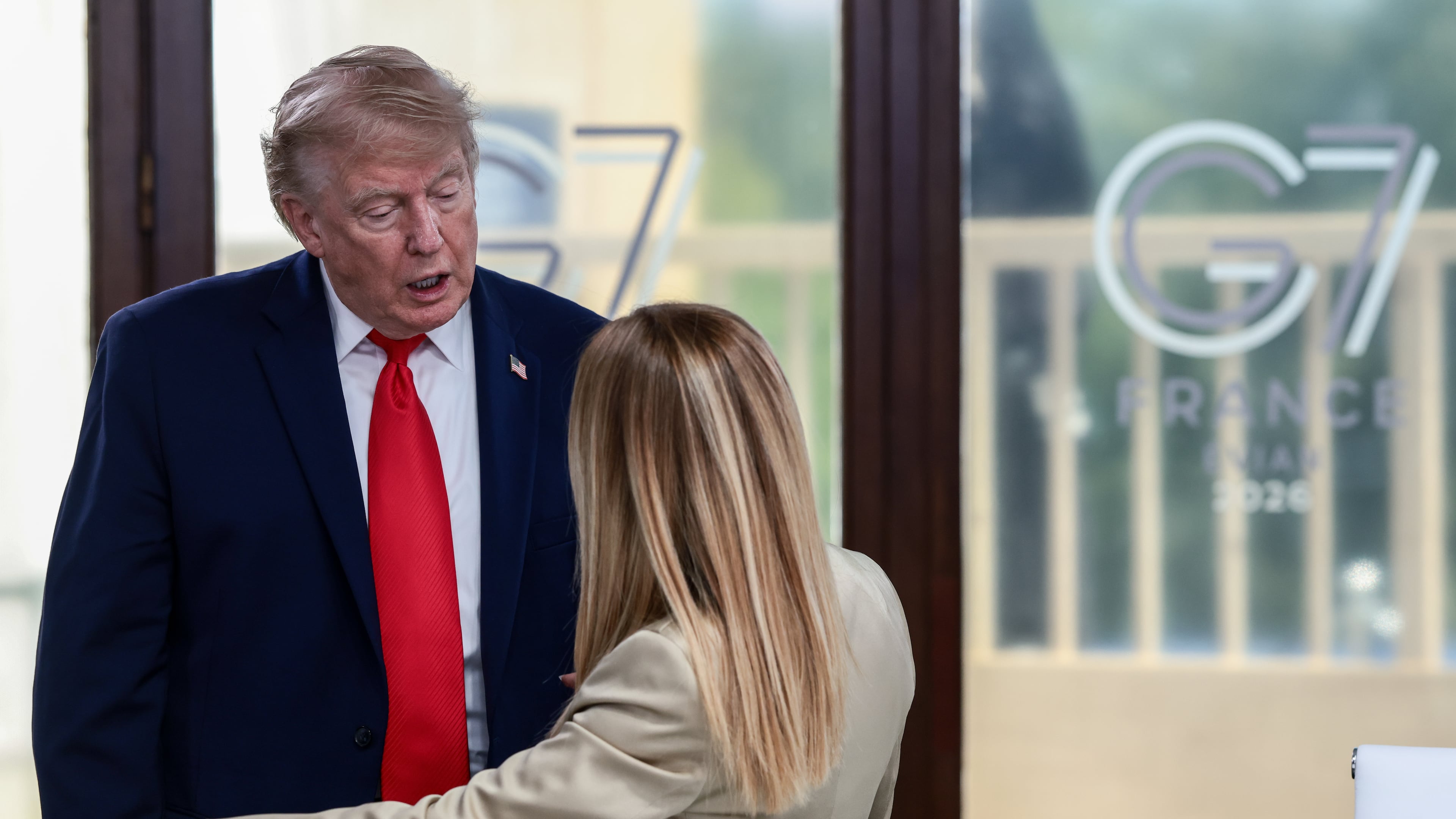 President Donald Trump speaks with Italian Prime Minister Giorgia Meloni at a working lunch with leaders of G7 and the Middle East in Evian-les-Bains, France, Tuesday, June 16, 2026. (Evelyn Hockstein/Pool Photo via AP)