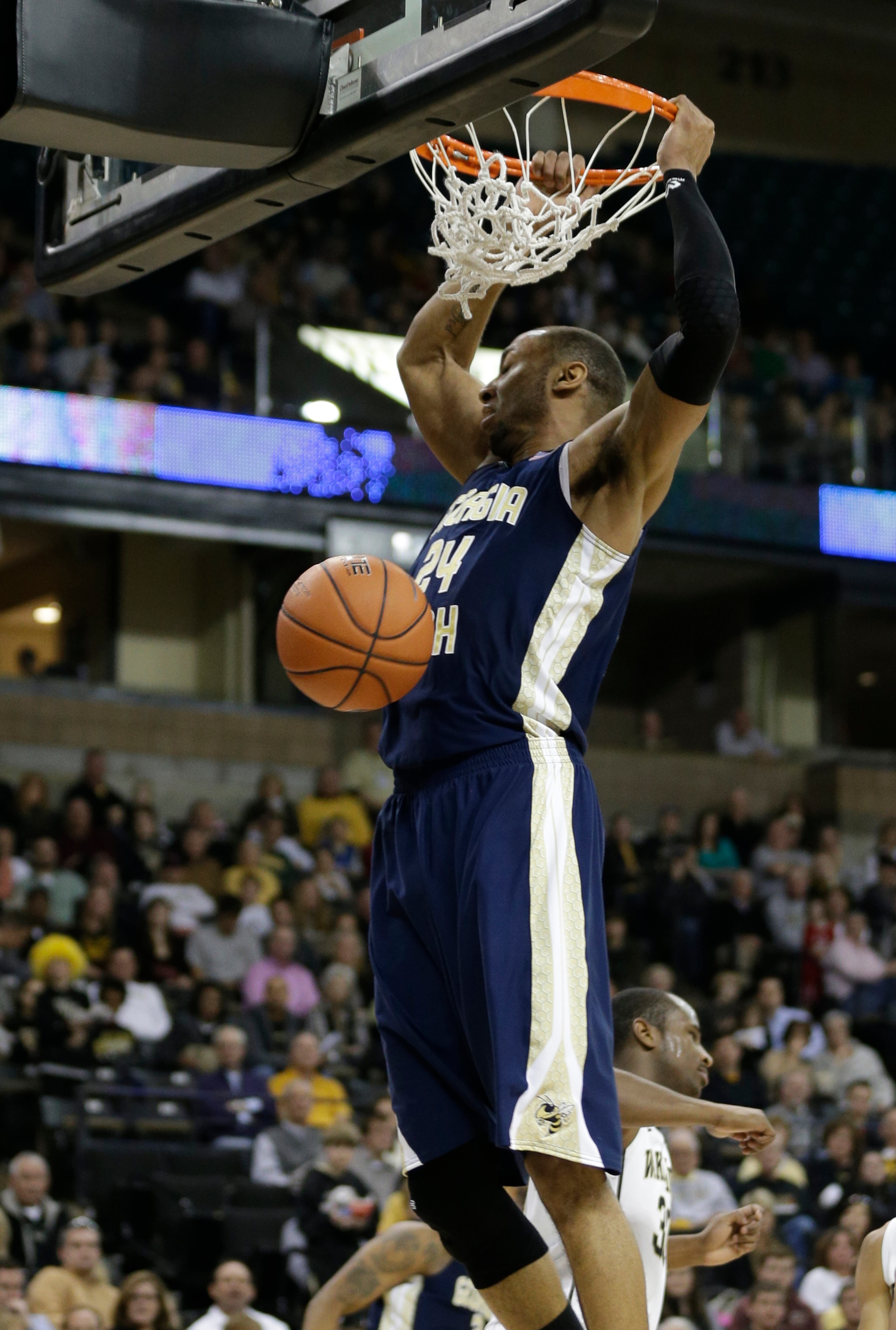 Georgia Tech's Kammeon Holsey (24) dunks against Wake Forest during the second half of an NCAA college basketball game in Winston-Salem, N.C., Saturday, Feb. 1, 2014. Georgia Tech won 79-70.