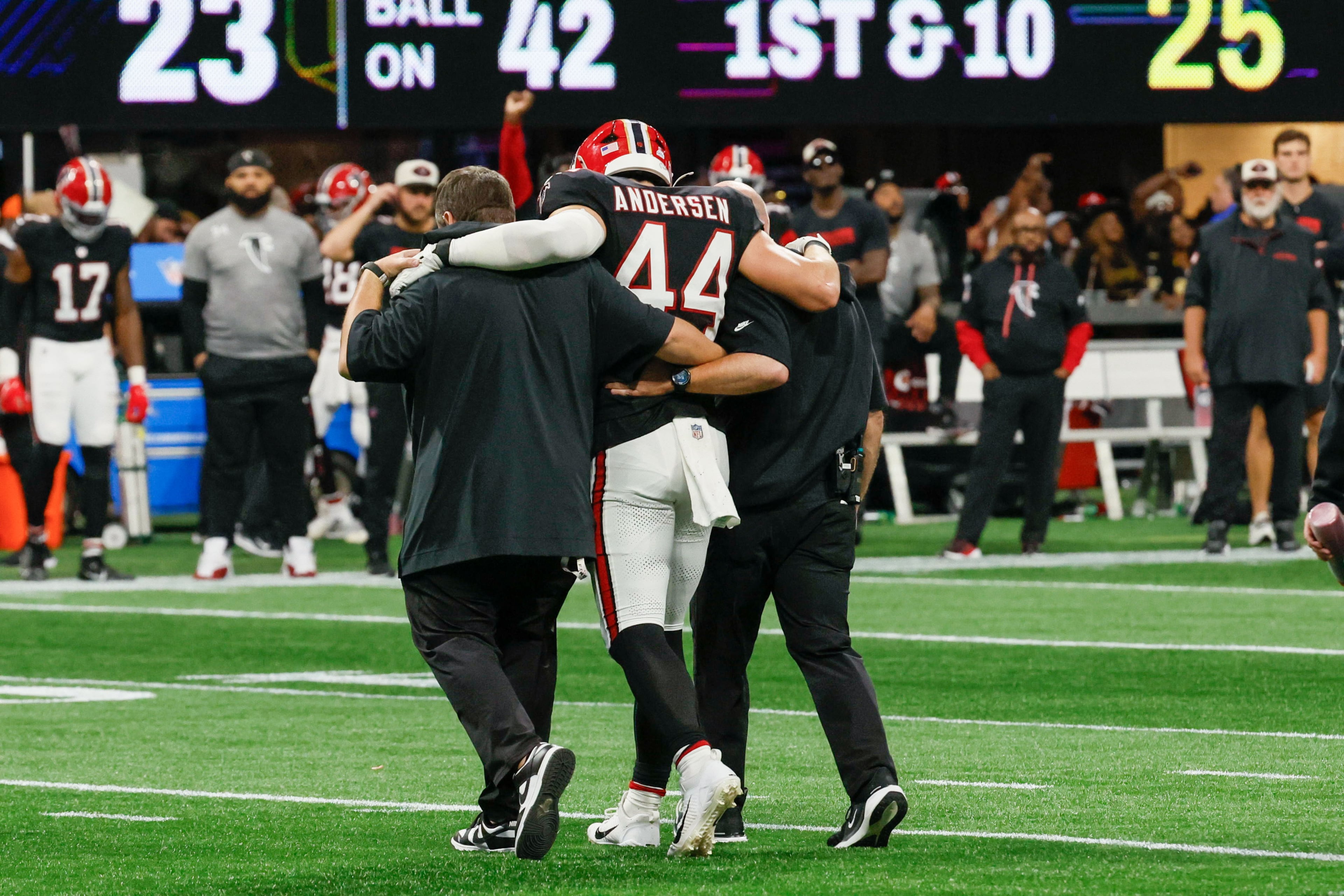 Linebacker Troy Andersen getting helped off the field after injuring his knee in Week 4 of last season.