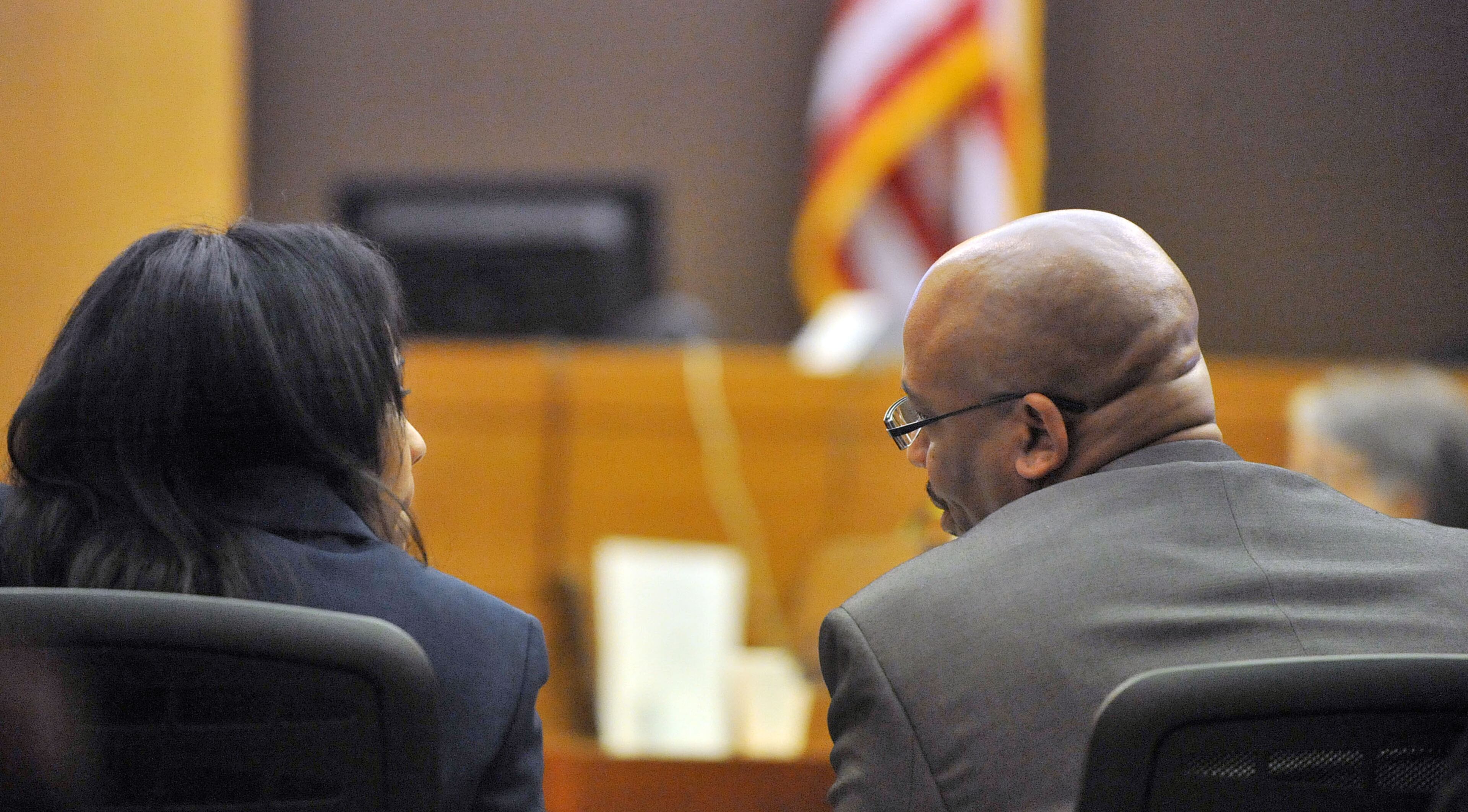 Fulton County Chief Senior Asst DA Fani Willis and Fulton County Senior ADA Clint Rucker confer during defense closing arguments Tuesday in the Atlanta Public Schools test-cheating trial before Judge Jerry Baxter in Fulton County Superior Court. (Atlanta Journal-Constitution, Kent D. Johnson, Pool)