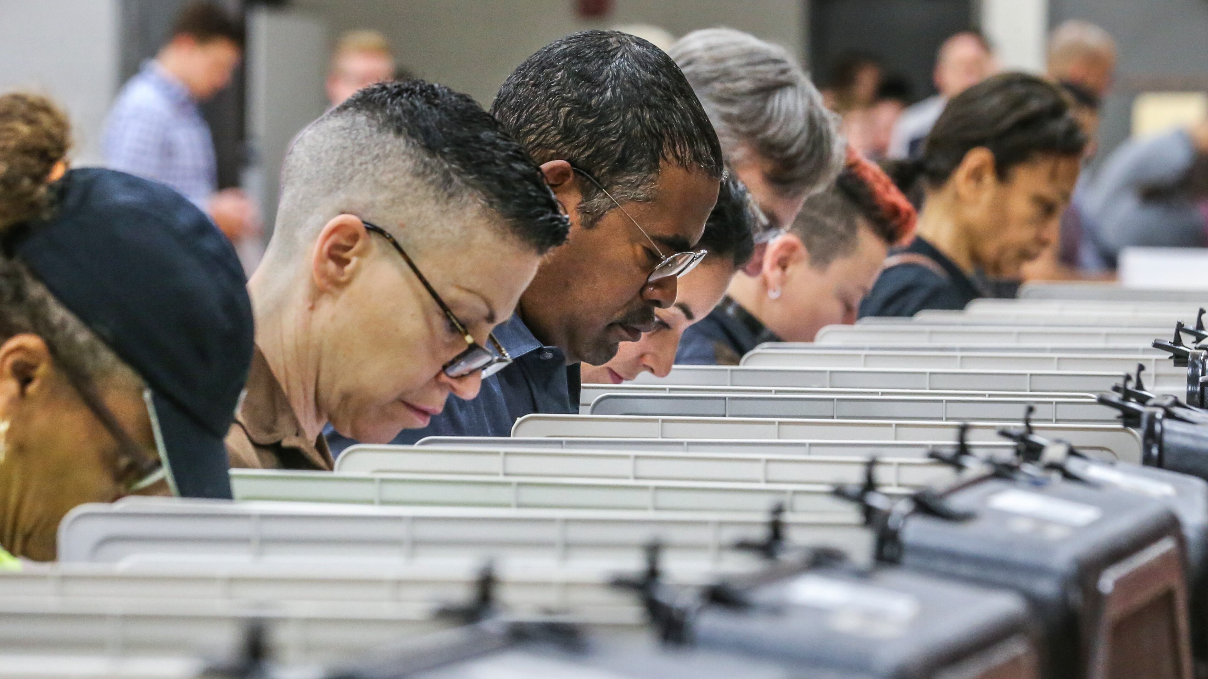 Voters lined up early at Henry W. Grady High School in Atlanta on Tuesday, Nov. 7, 2017 to cast their votes in Atlanta's mayoral election. JOHN SPINK/JSPINK@AJC.COM