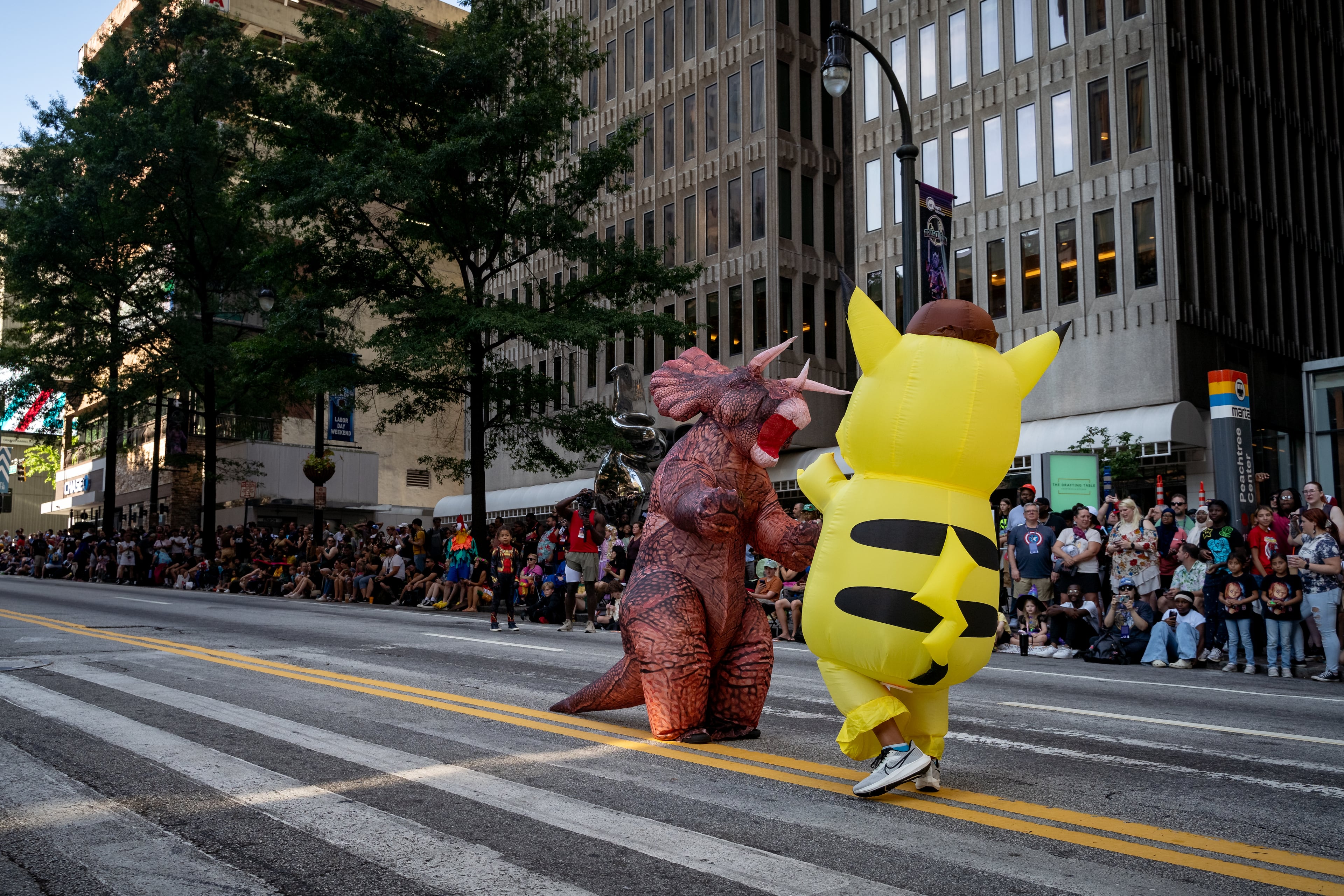 Thousands lined up along Peachtree Street on Saturday morning, August 31, 2024, for the annual Dragon Con parade in Atlanta. (Ben Hendren for The Atlanta Journal-Constitution)