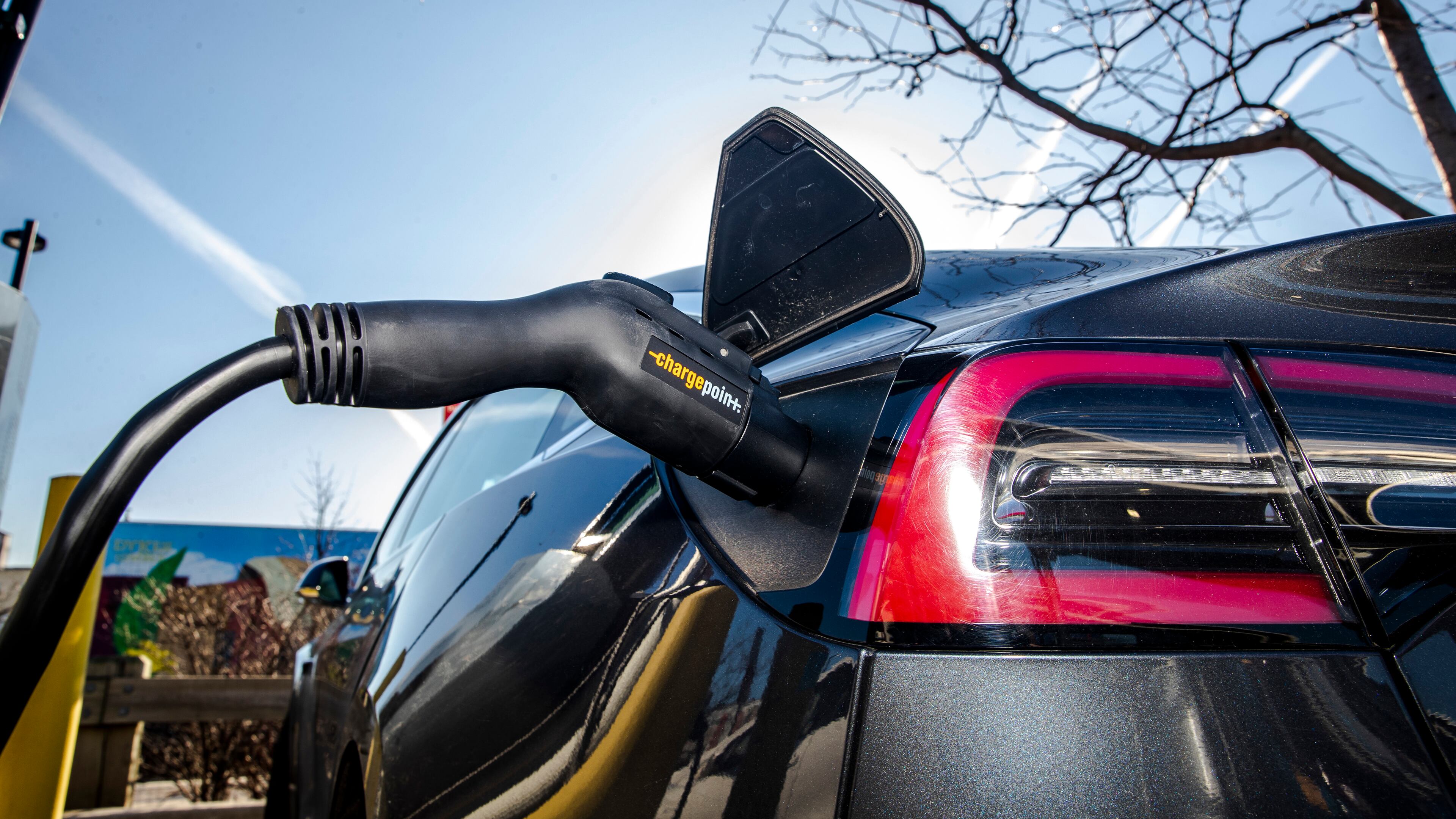 A charging station for electric vehicles in a parking lot at a Whole Foods in New York, March 9, 2020. The Biden administration announced new standards for federally-funded EV chargers Wednesday. (Brittainy Newman/The New York Times)