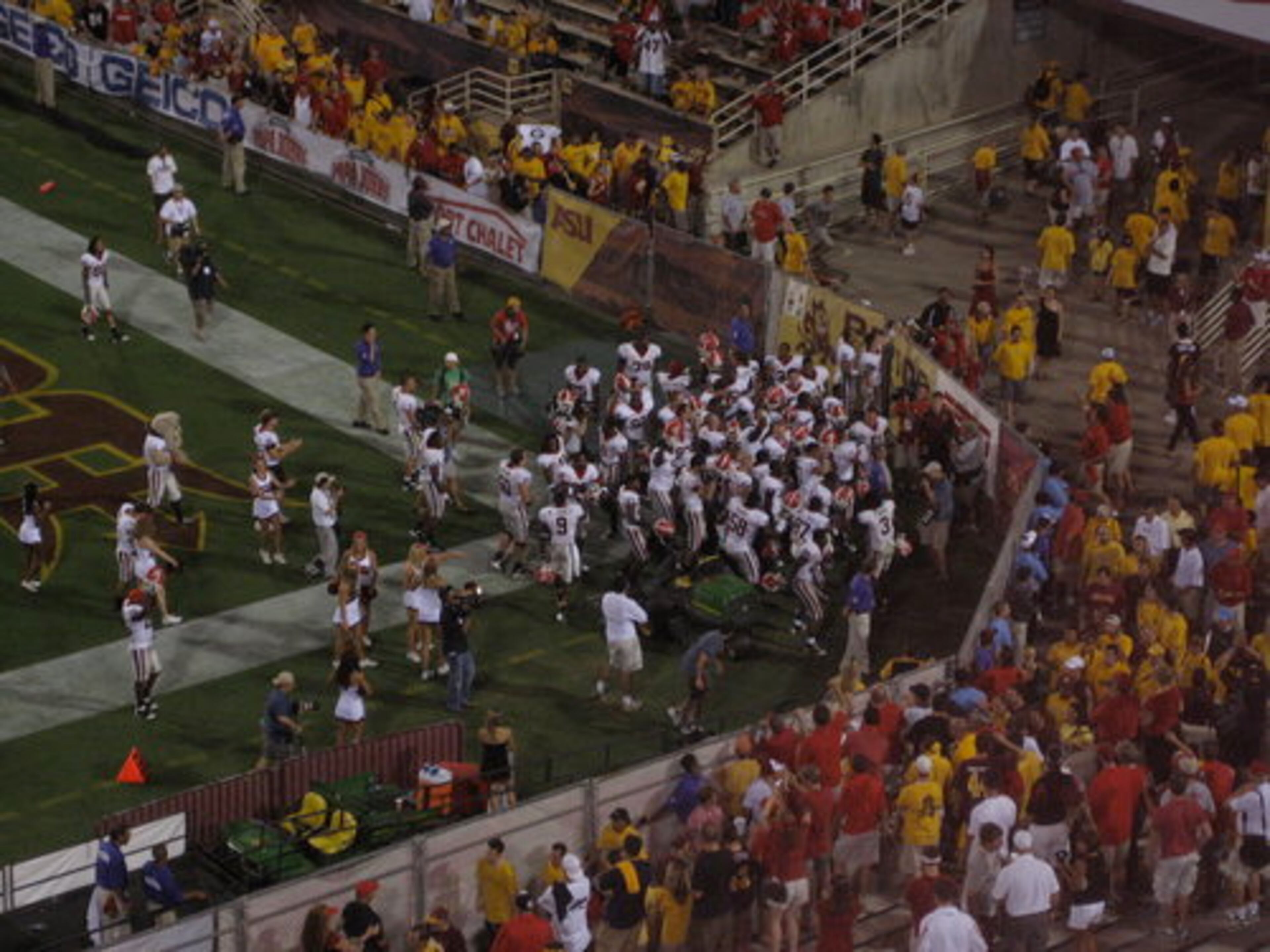 End of the game when all the players ran down to the DAWG section.