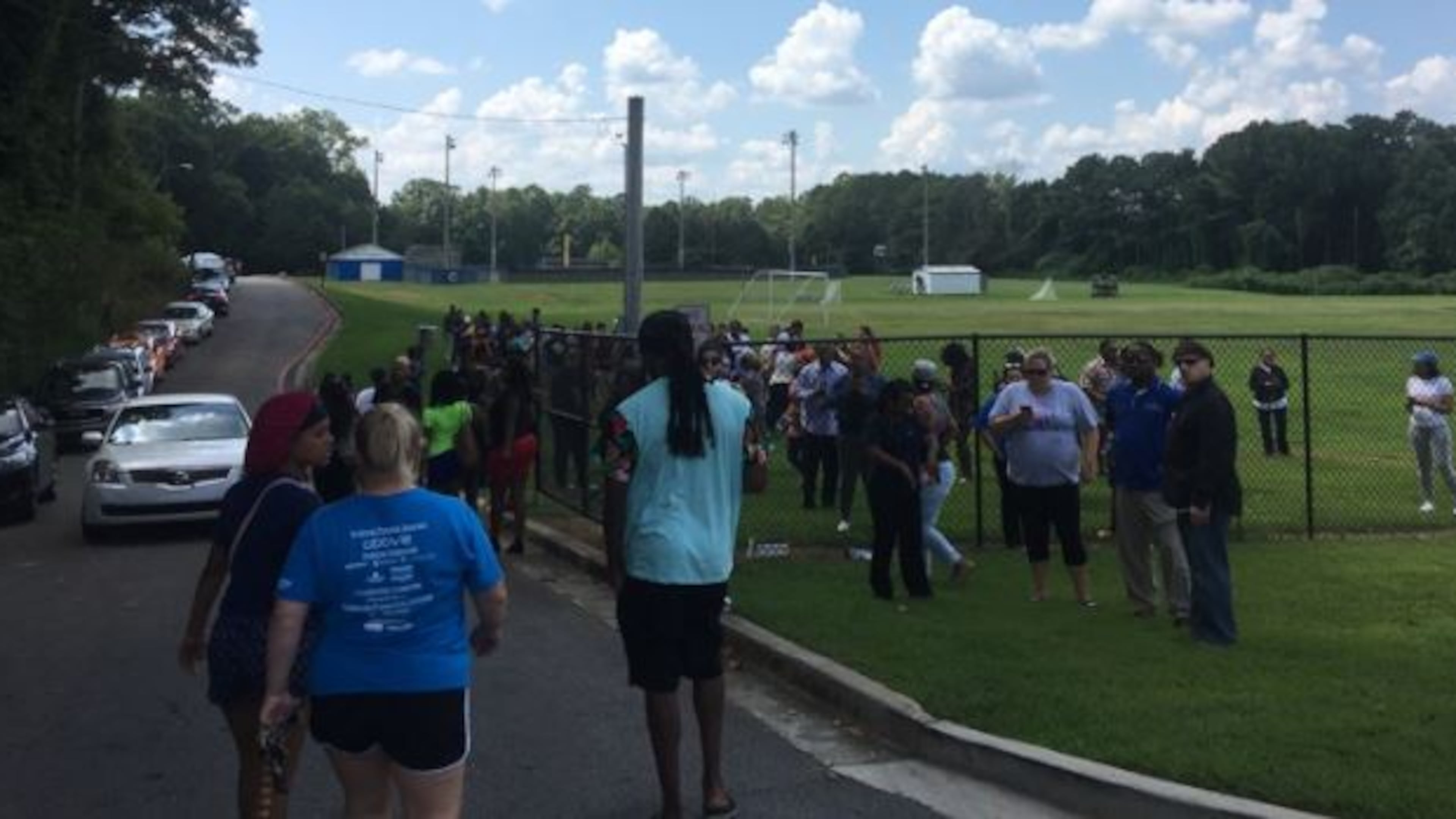Parents picked up their children at a nearby soccer field after the lockdown at Campbell High School on Monday.