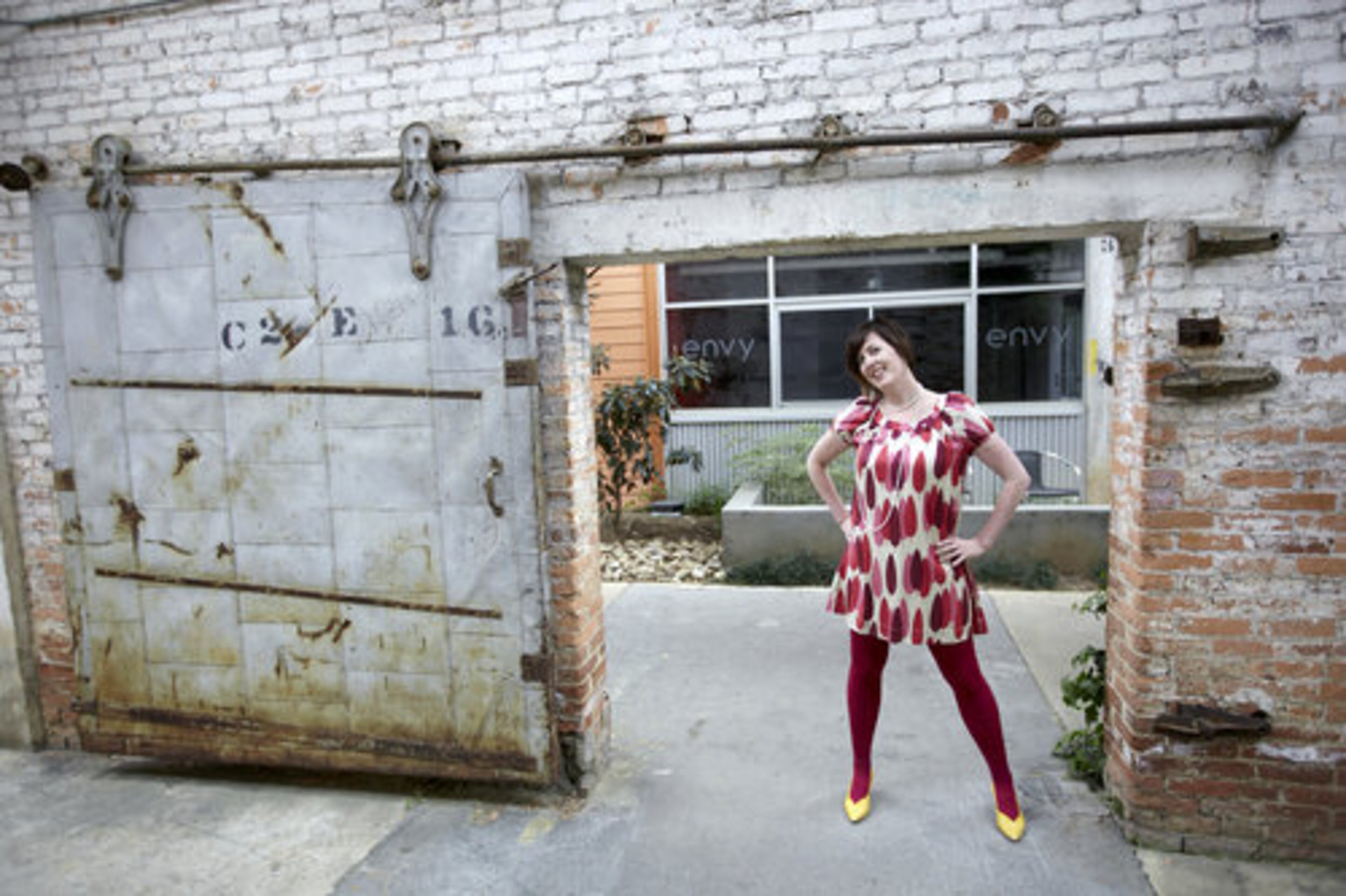 Bransford wears an Orla Kiely tree print shift dress with a set of vintage pearls from her mom.