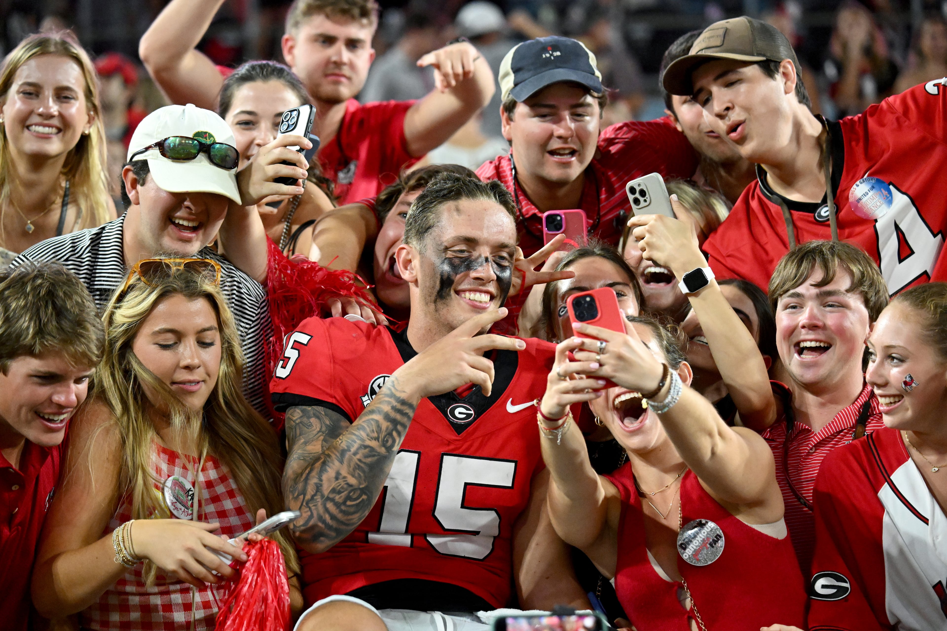 Georgia quarterback Carson Beck (15) celebrates with fans after Georgia beat Florida during the NCAA football game at EverBank Stadium, Saturday, November 2, 2024, in Jacksonville, Fla. Georgia won 34-20 over Florida. (Hyosub Shin / AJC)