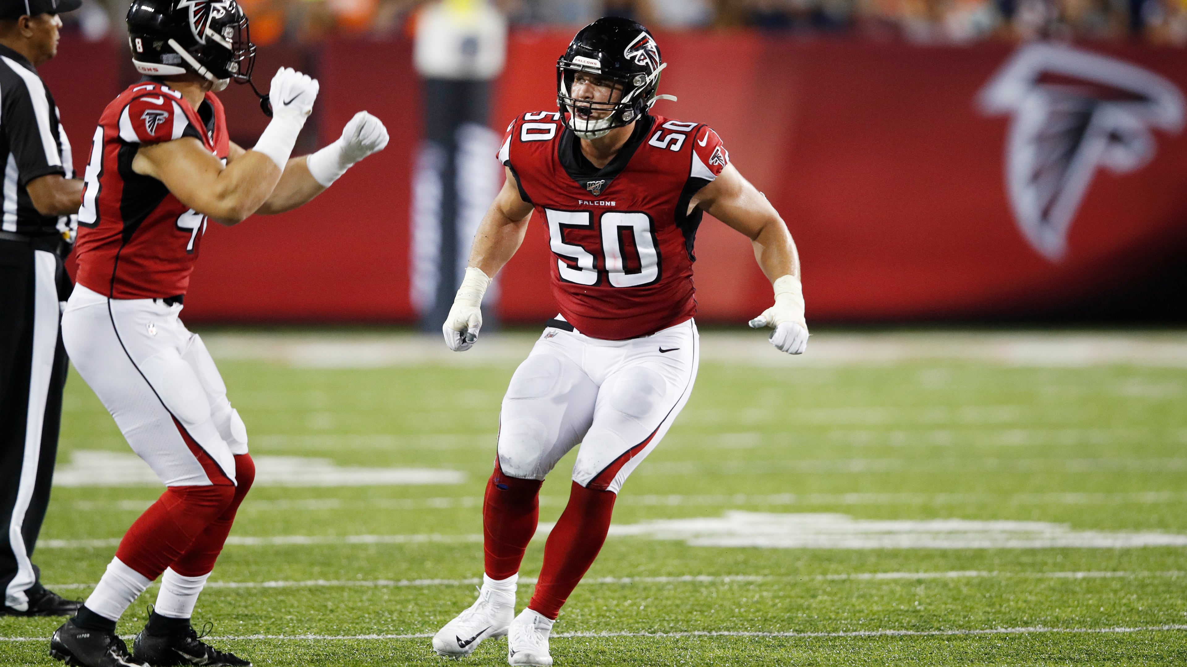 John Cominsky #50 of the Atlanta Falcons celebrates after a sack in the first half of a preseason game against the Denver Broncos at Tom Benson Hall Of Fame Stadium on August 1, 2019 in Canton, Ohio. (Photo by Joe Robbins/Getty Images)