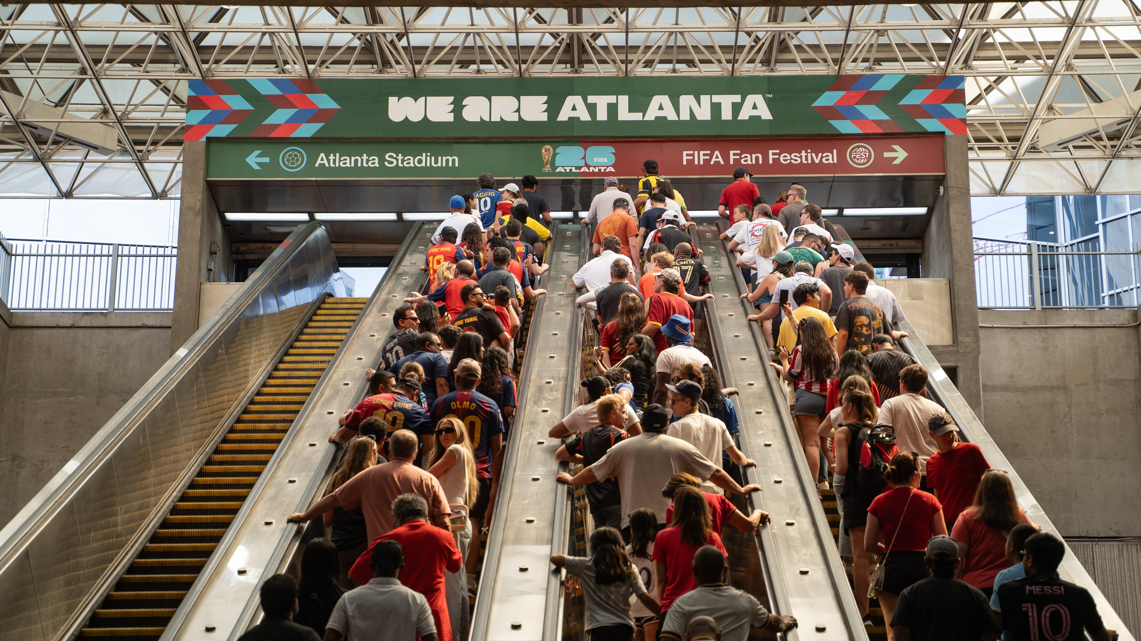 Fans ride the escalators inside the SEC District MARTA station to attend the first FIFA World Cup match in Atlanta, on June 15, 2026. (Ben Hendren for the AJC)