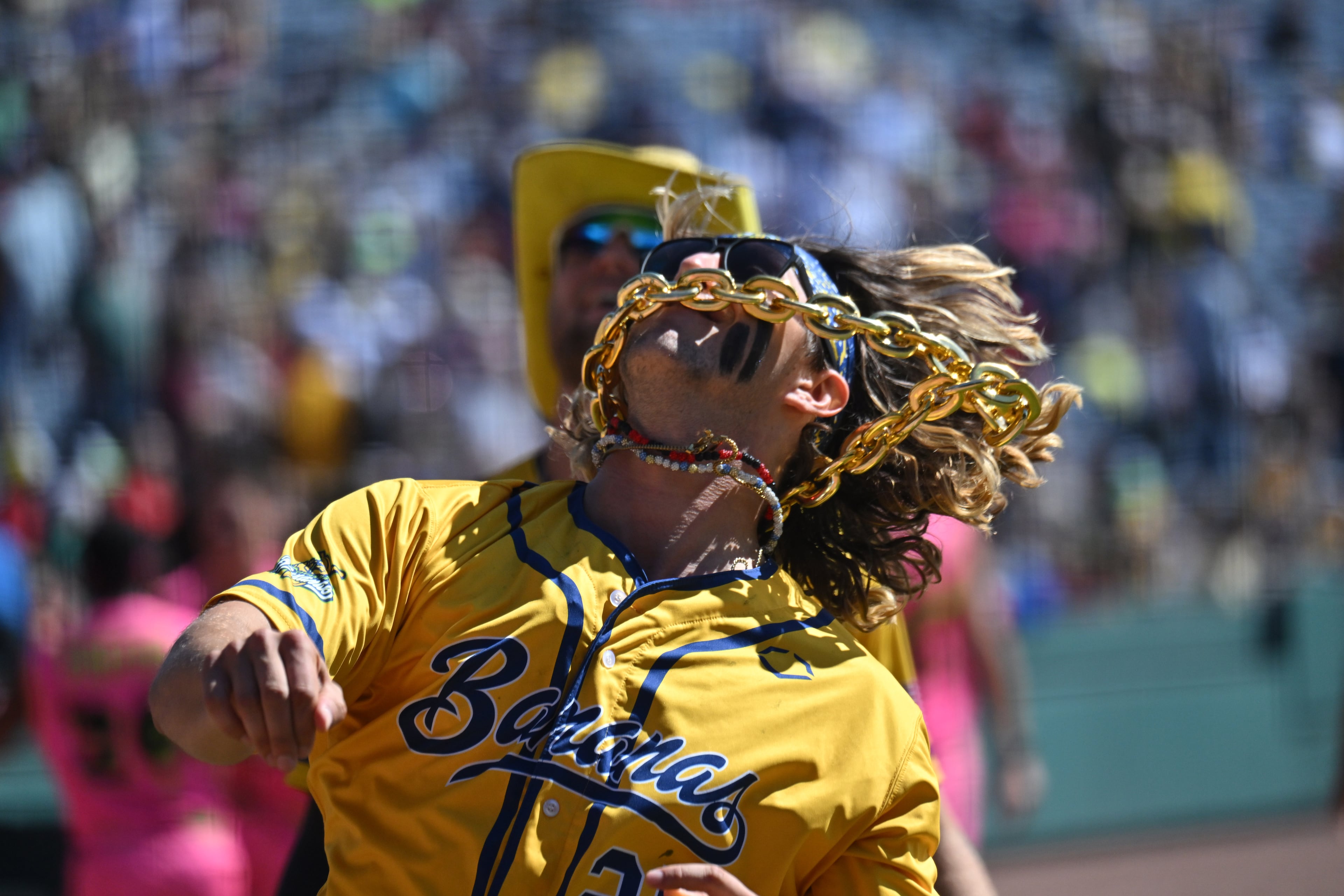 Savannah Bananas' Christian Dearman (25) throws t-shirts to fans during pregame events. (Hyosub Shin / Hyosub.Shin@ajc.com)