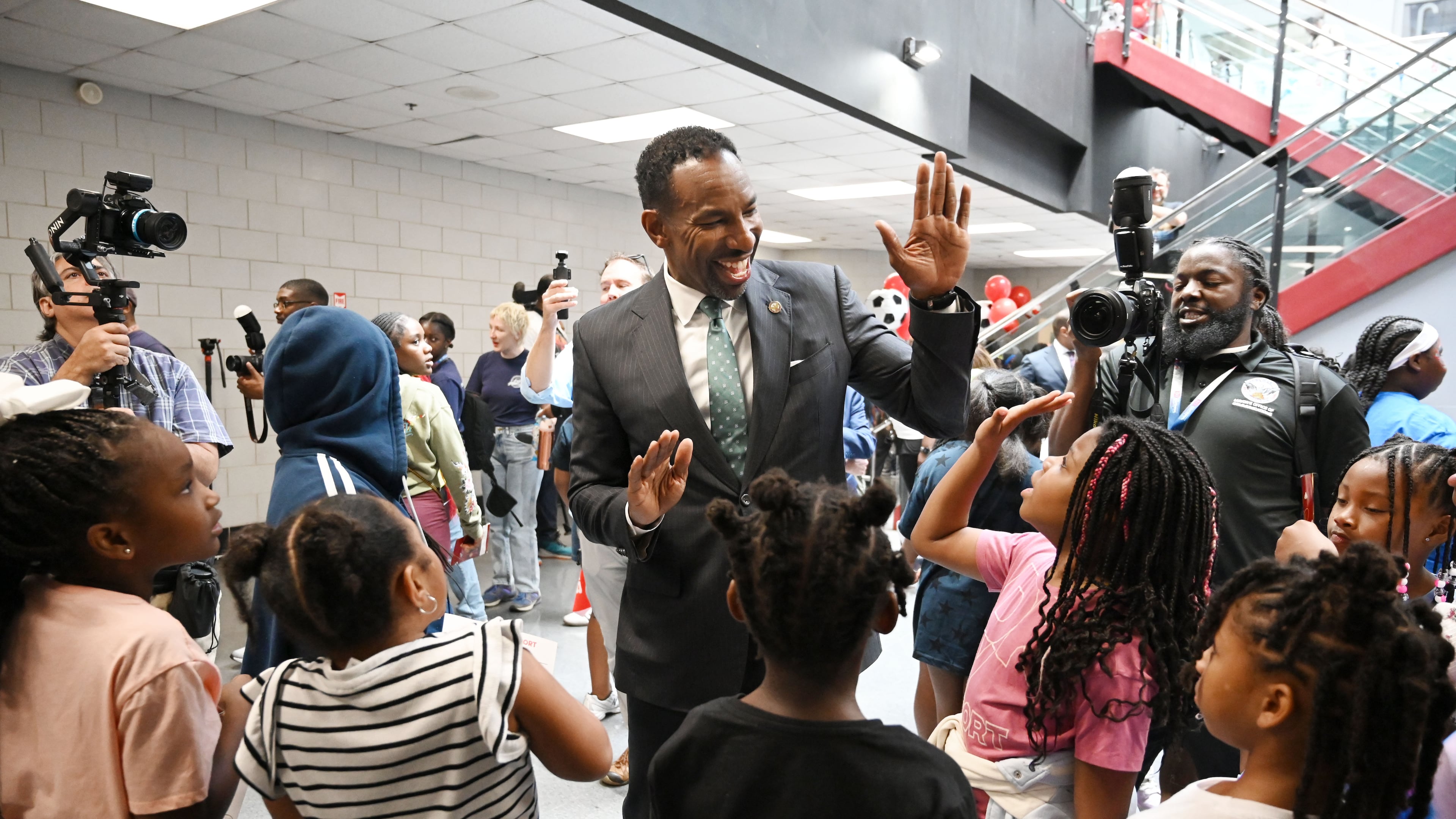 Atlanta Mayor Andre Dickens is greeted by camp participants as he tours the FIFA World Cup 2026 pep rally at the city’s youth summer camps, “One World, One Goal,” at the C.T. Martin Natatorium and Recreation Center on Tuesday, June 9, 2026, in Atlanta. (Hyosub Shin/AJC)