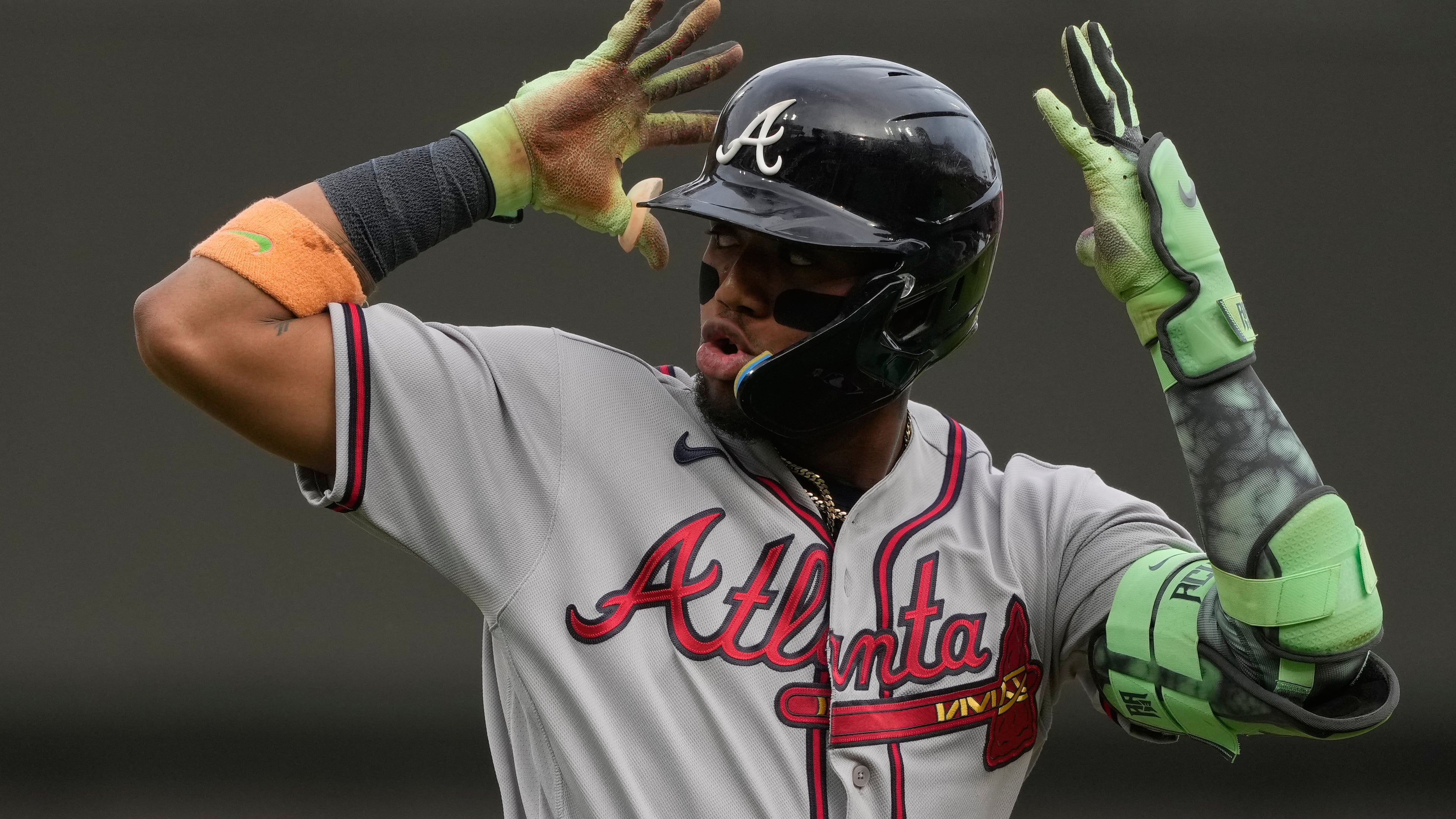 Atlanta Braves right fielder Ronald Acuña Jr. reacts as he round third base after hitting a solo home run during the first inning of a baseball game against the Cincinnati Reds in Cincinnati, Friday, May 29, 2026. (AP Photo/Carolyn Kaster)