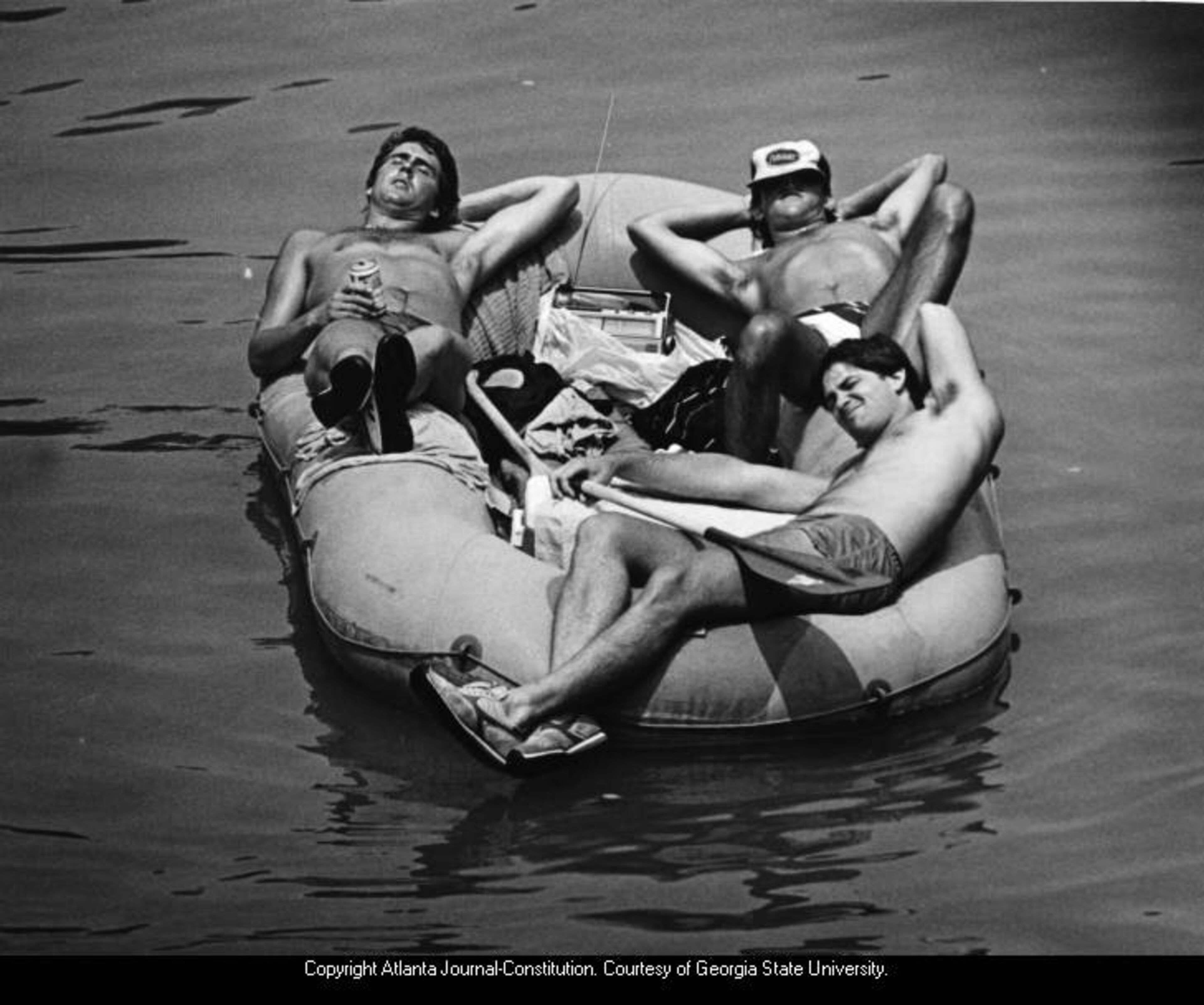 1984 -- Three men in a rubber raft on the Chattahoochee River, Atlanta. CHERYL BRAY / AJC FILE