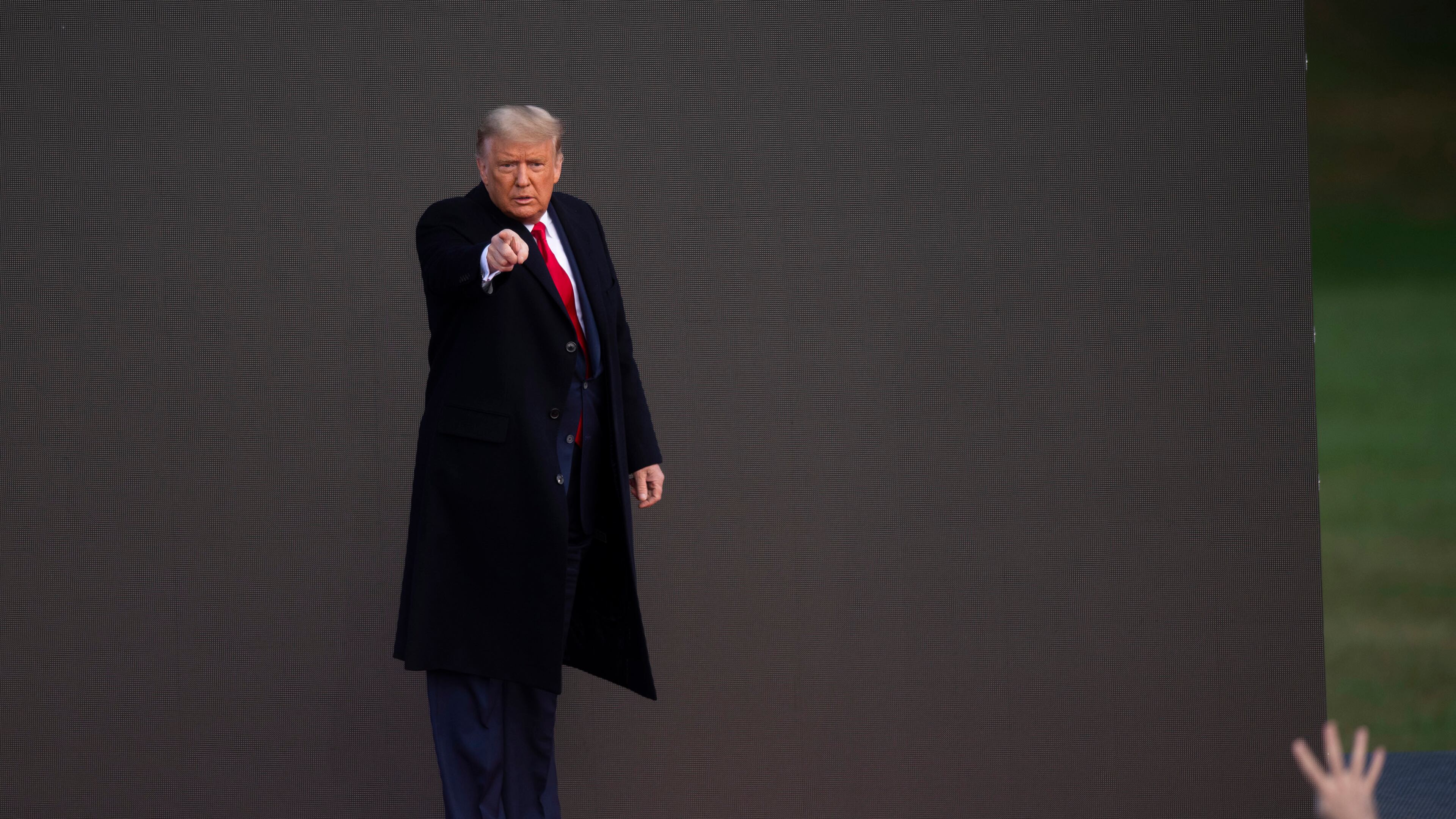 President Donald Trump acknowledges supporters after holding a campaign rally on Satruday, Oct. 31, 2020, in Newtown, Pennsylvania. With the election only three days away, Trump planned four rallies across Pennsylvania Satuday, as he vies to recapture the Keystone State's vital 20 electoral votes. In 2016, he carried Pennsylvania by only 44,292 votes out of more than 6 million cast, less than a 1 percent differential, becoming the first Republican to claim victory here since 1988. (Mark Makela/Getty Images/TNS)