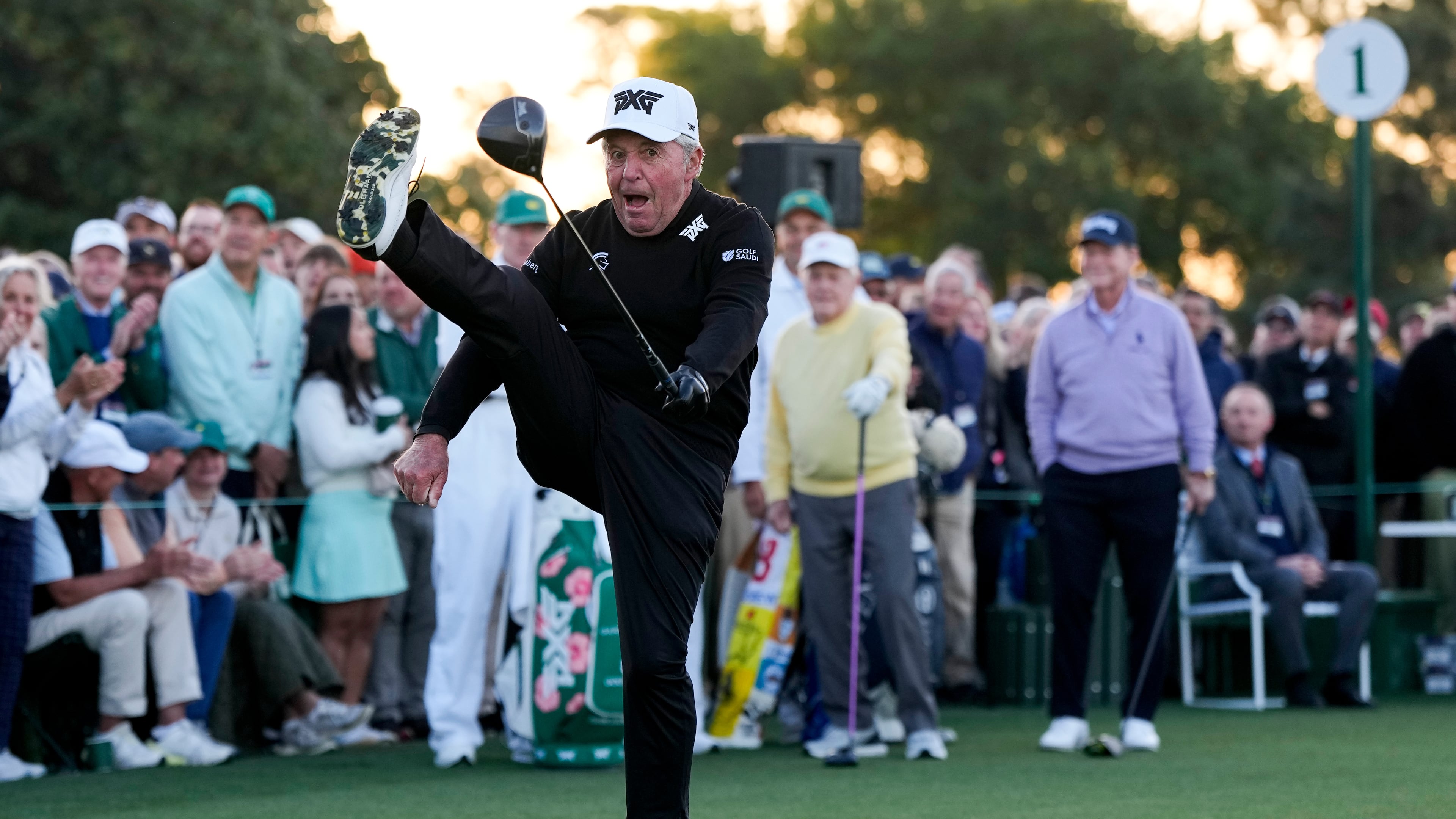 Gary Player kicks his leg in the air after hitting the ceremonial tee shot on the first hole during the first round of the Masters golf tournament at the Augusta National Golf Club, Thursday, April 9, 2026, in Augusta, Ga. (AP Photo/David J. Phillip)