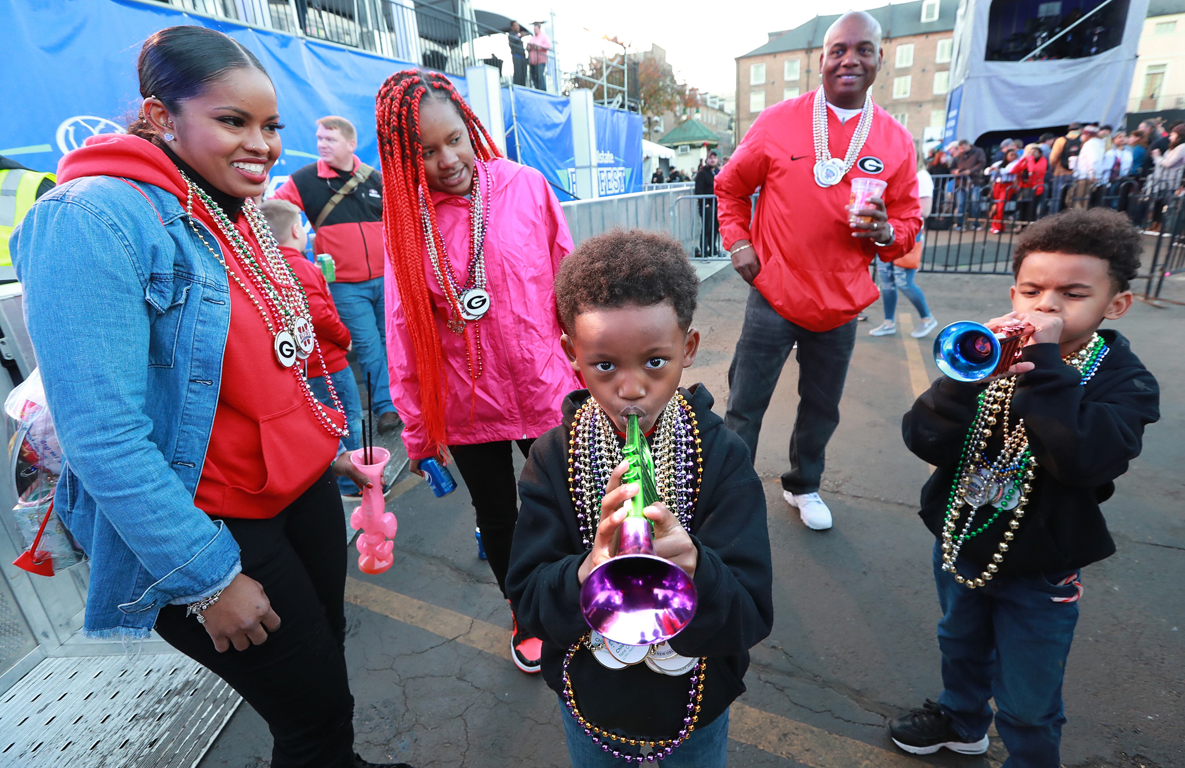 Yasmen and Tommy Barnett and their daughter Jaila look on while their twin sons Chase (left) and Carson play trumpets. Curtis Compton ccompton@ajc.com