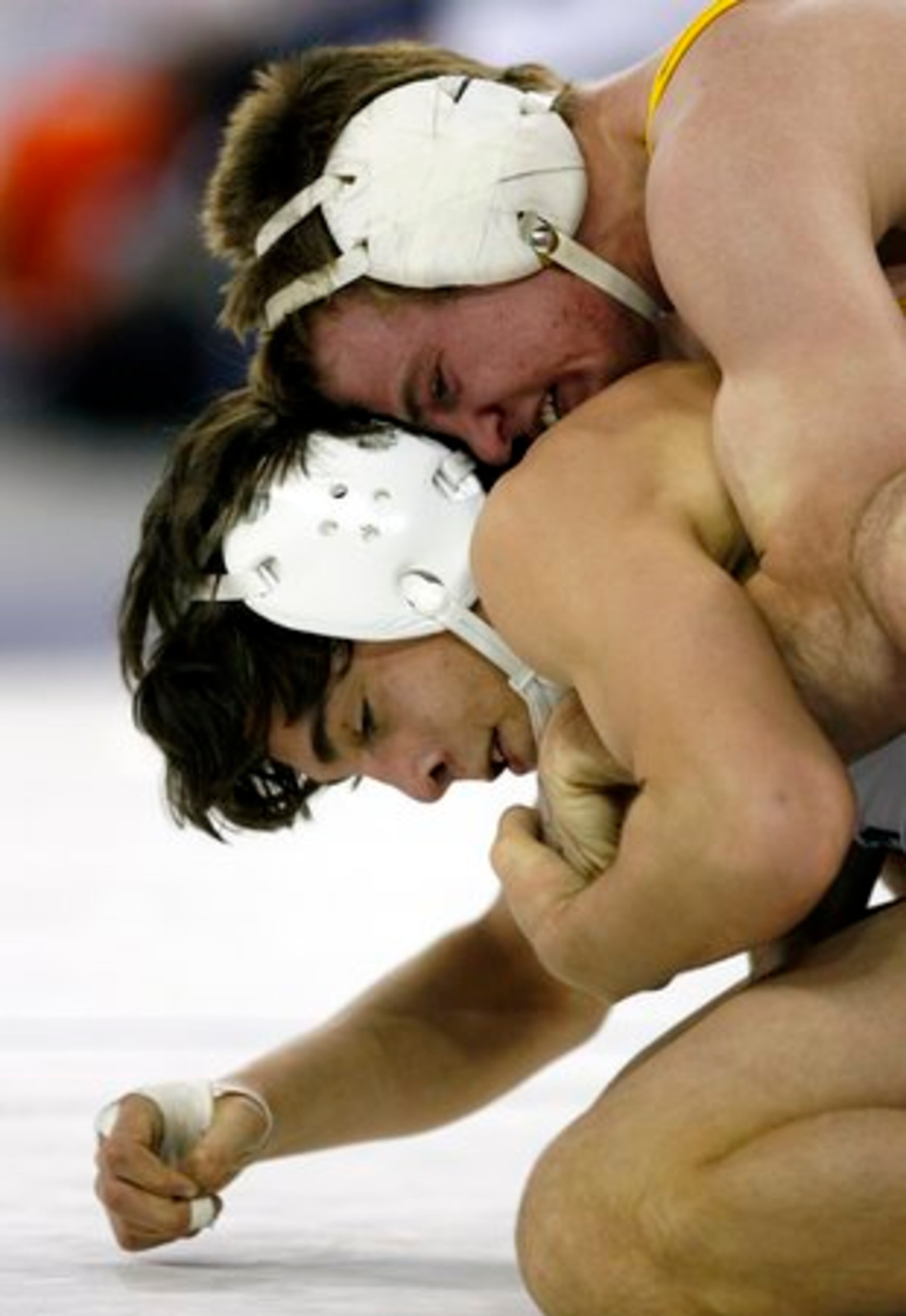Dacula's Noah Hunt (top) and Collins Hill's T.J. Mitchell compete during the Class AAAAA 119-pound finals of Georgia State Traditional Wrestling Tournament in The Arena at Gwinnett Center in Duluth. Mitchell added to several Collins Hill wins. The three-day event brought together wrestlers from all over the state to compete for individual titles.