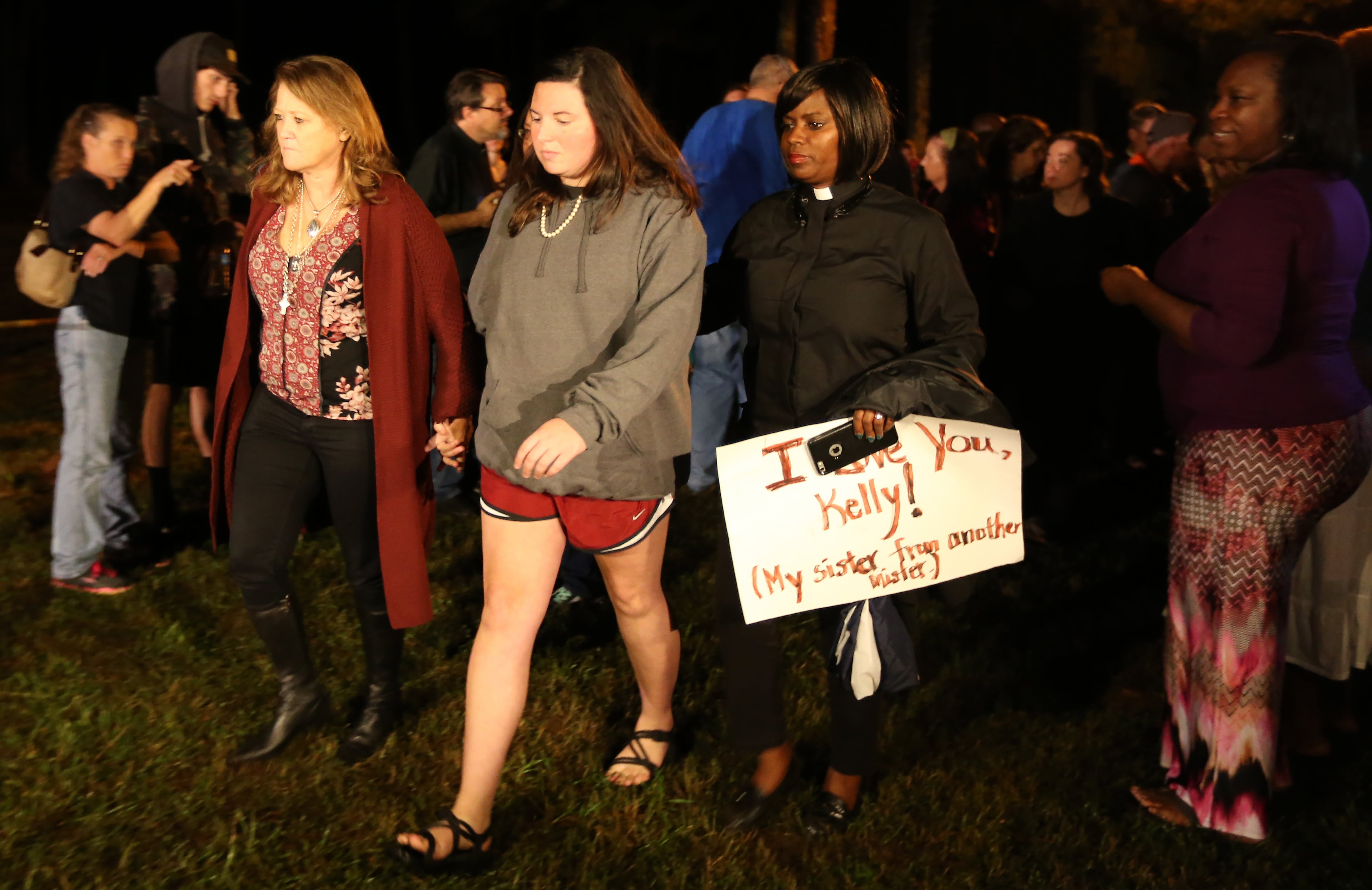 Kayla Gissendaner, center, walks with the Rev. Della Bacote, right, after thanking supporters who were protesting outside of Georgia Diagnostic Prison in Jackson on Tuesday evening September 29, 2015 before the scheduled execution of her mother Kelly Gissendaner. Ben Gray / bgray@ajc.com