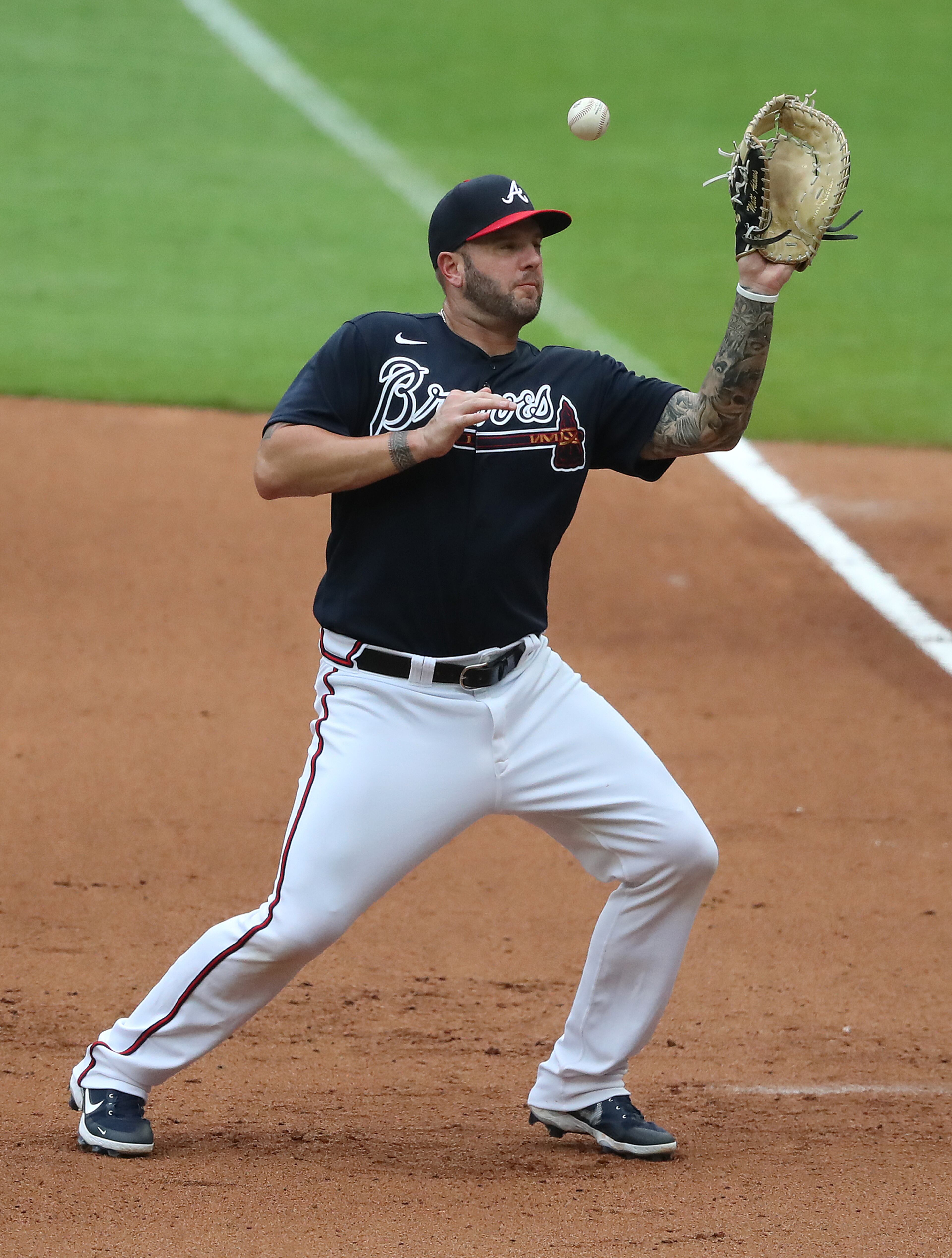 Atlanta Braves first baseman Matt Adams misses a ball hit by Miami Marlins' Isan Diaz. Curtis Compton ccompton@ajc.com