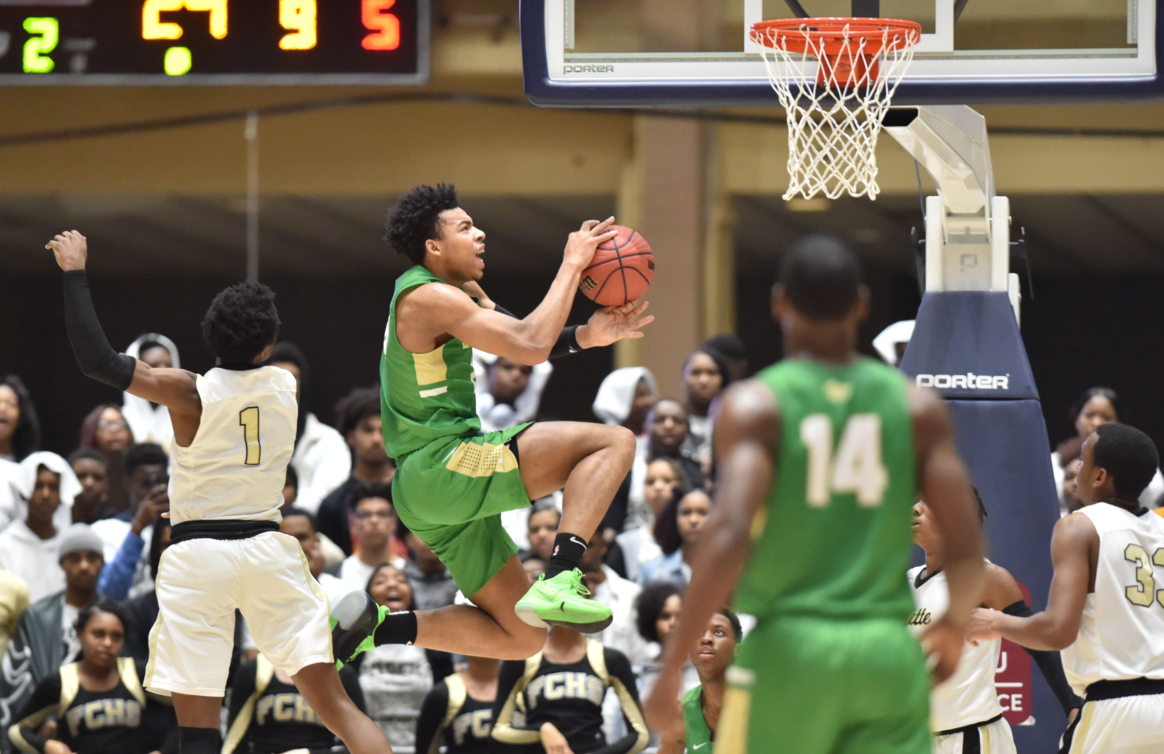 March 8, 2019 Macon - Buford Eric Coleman (20) goes to the basket in GHSA State Basketball Championship game at the Macon Centreplex in Macon on Friday, March 8, 2019. Buford won 67-59 over the Villa Rica. HYOSUB SHIN / HSHIN@AJC.COM