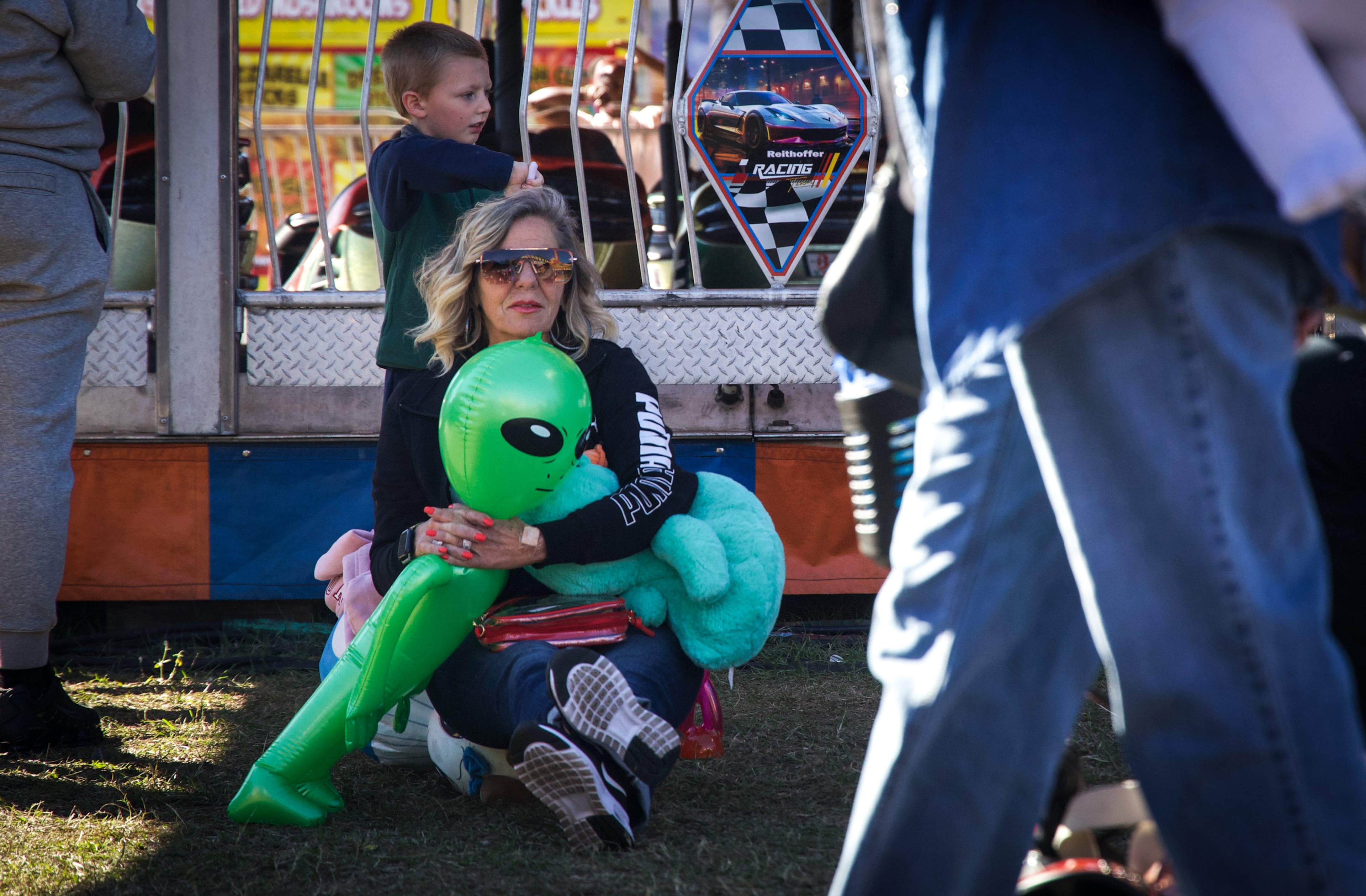 Brenda Rice and her grandson Sawyer Spivey from Macon take a rest at the Georgia National Fair in Perry, Georgia, on Oct. 17, 2026. Rice brings her grandchildren to the fair every year. (Emily Laycock/UGA Photojournalism Workshop)