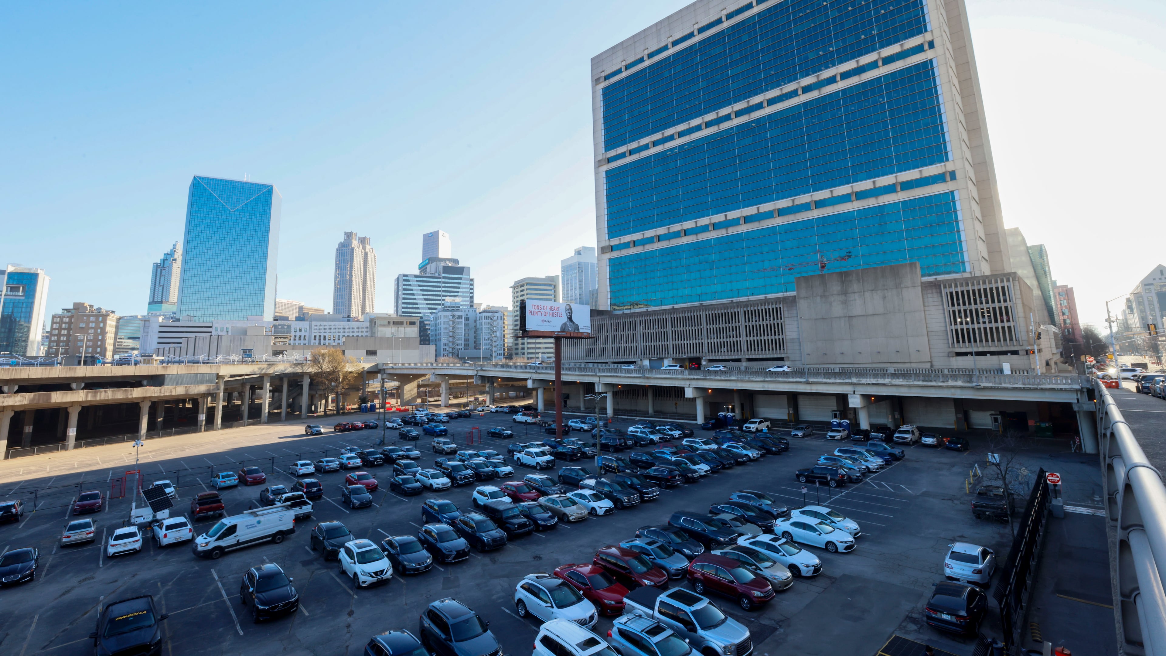 The parking lot known as the Gulch, primarily utilized by federal employees of the Richard B. Russell Federal Building and the Sam Nunn Atlanta Federal Center, began to reach capacity on Monday, February 24, 2025. This date marked the first full return-to-office day for many federal workers in downtown Atlanta. (Miguel Martinez/ AJC)