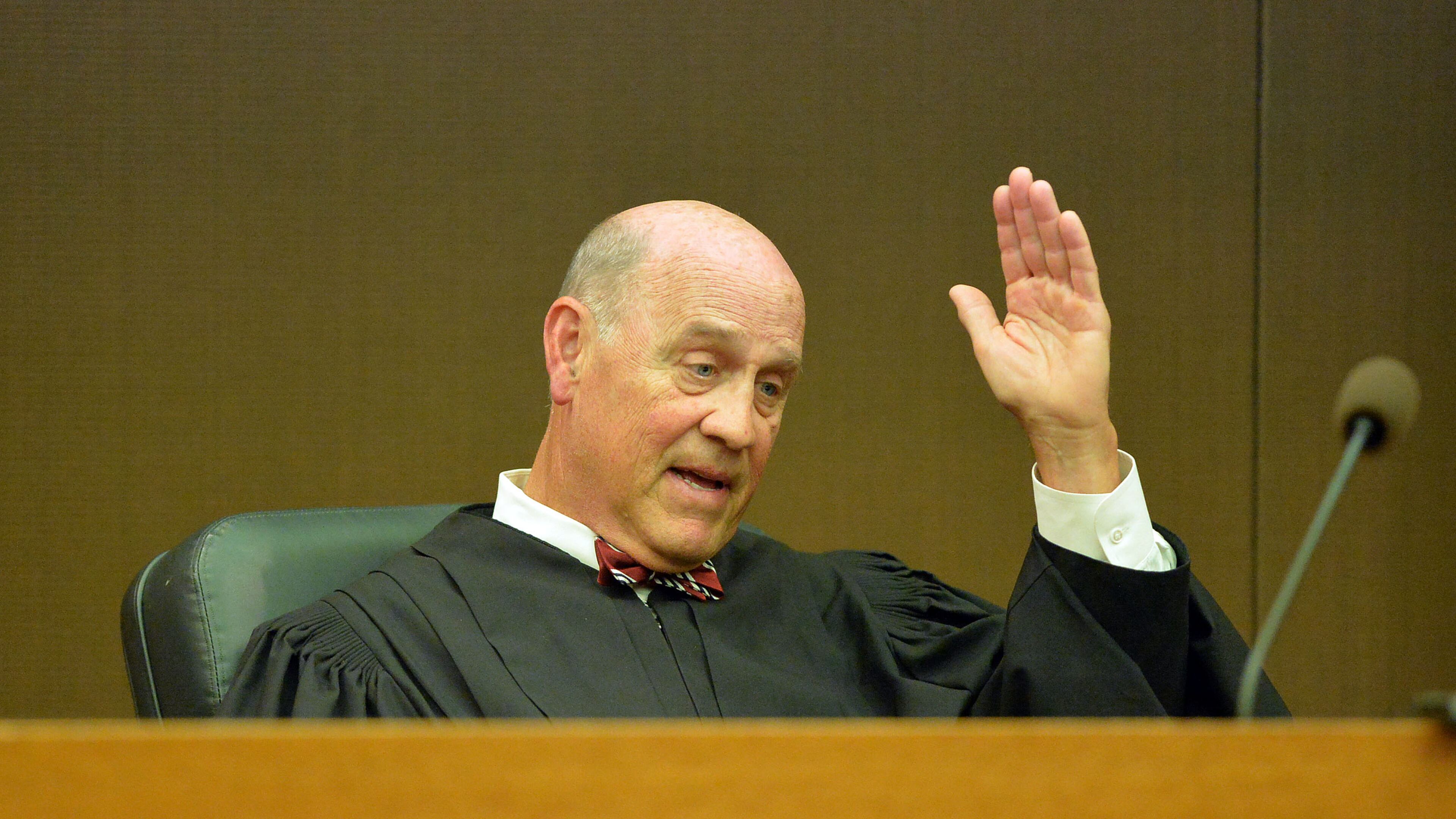 Fulton County Superior Court Judge Jerry Baxter says "Adios" following a re-sentencing hearing in Fulton County Superior Court, Thursday, April 30, 2015. Former regional directors Tamara Cotman, Sharon Davis-Williams and Michael Pitts were given the heftiest punishment — 20 years, seven years to be served in prison and 13 years on probation following their convictions racketeering and other charges in the Atlanta Public Schools test-cheating trial. Fulton County Superior Court Judge Jerry Baxter resentenced the trio to 3 years in prison, 7 years probation, $10,000 fine and 2000 hours of community service. (Atlanta Journal-Constitution, Kent D. Johnson, Pool)