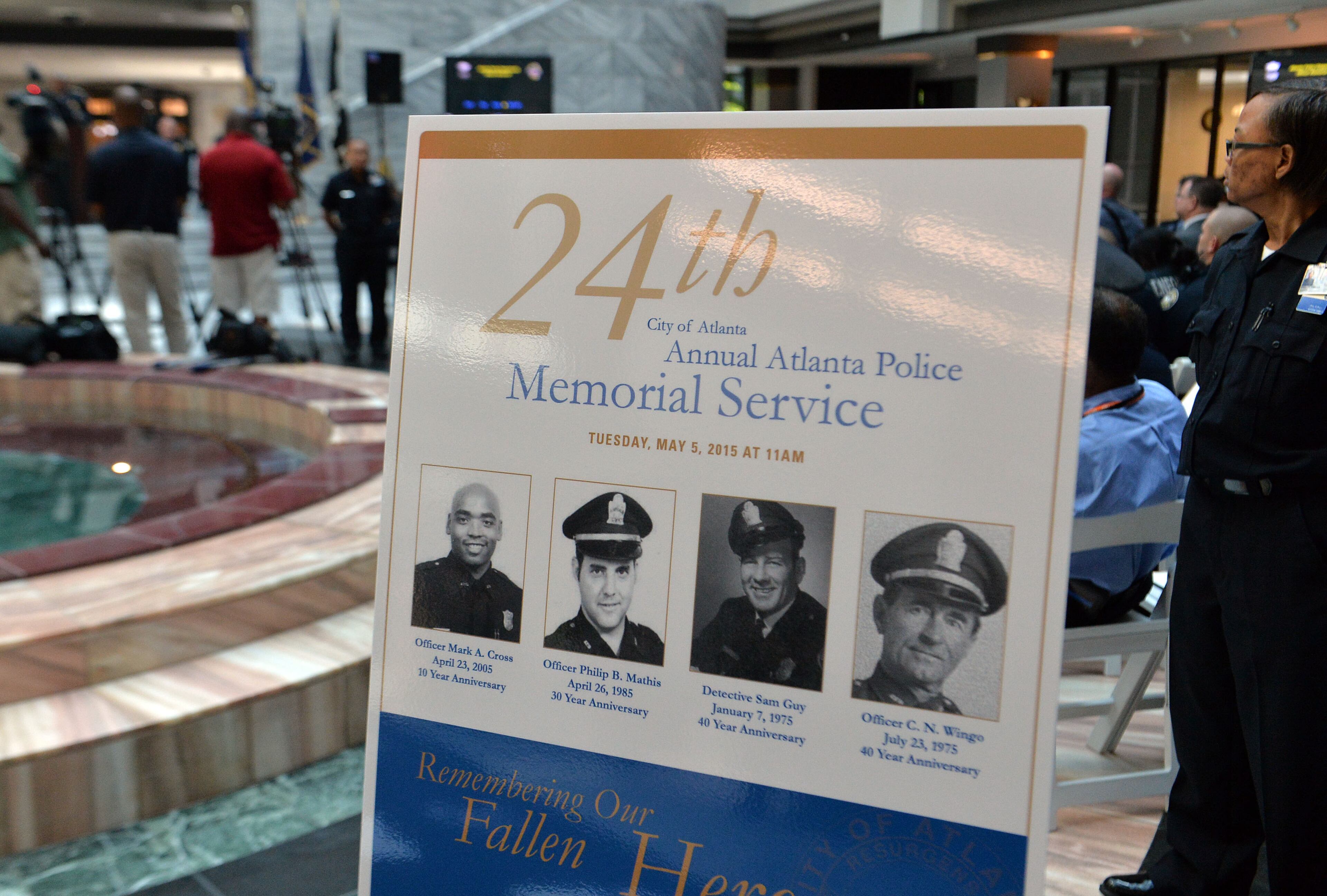 The Atlanta Police Department recognized 82 fallen officers during the 24th Annual Police Memorial Service at the Atlanta City Hall atrium, Tuesday, May 5, 2015. The Right Rev. Robert C. Wright of the Episcopal Diocese of Atlanta was the keynote speaker. KENT D. JOHNSON /KDJOHNSON@AJC.COM