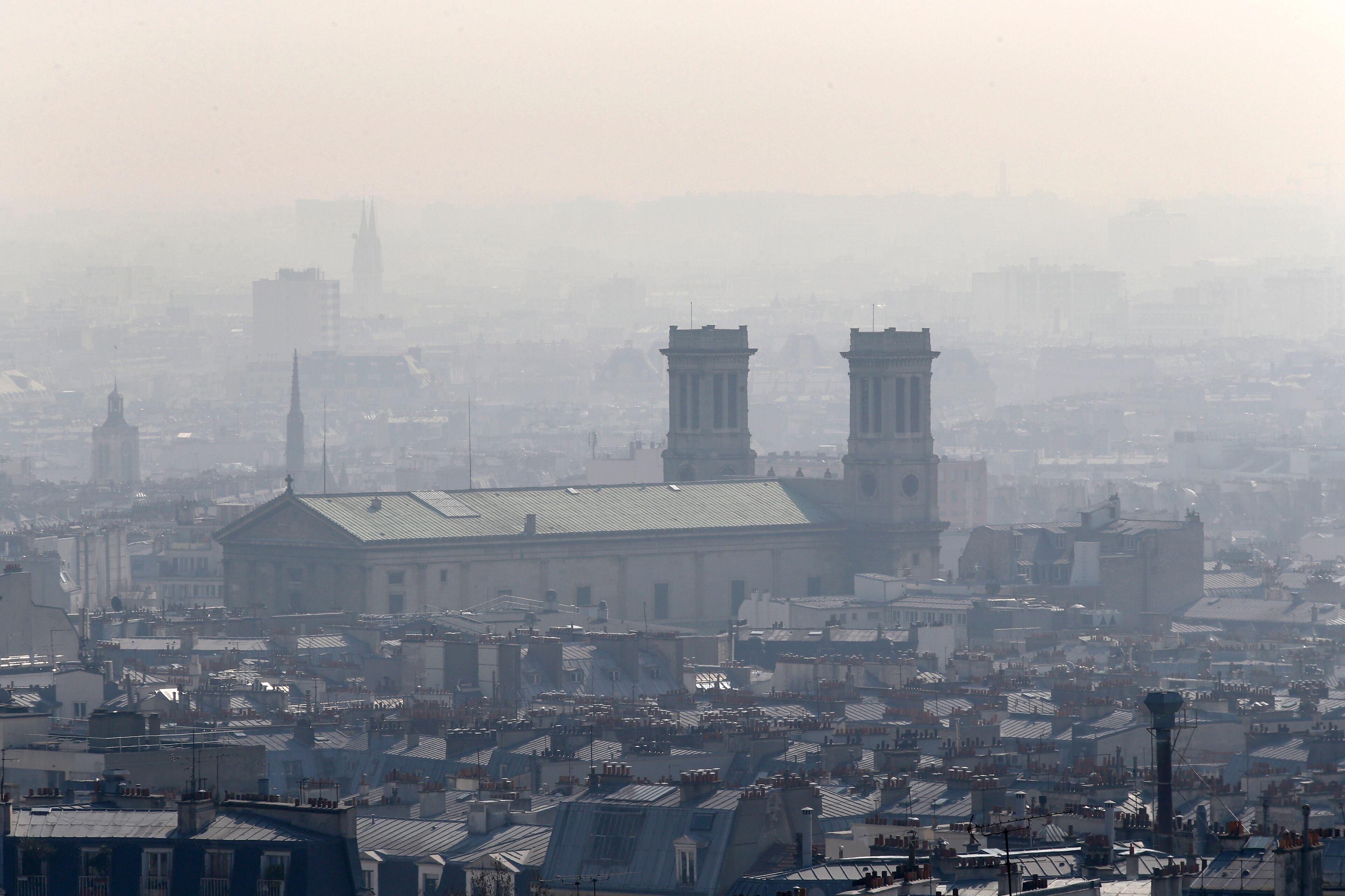 The Saint Vincent de Paul church is seen through the smog in Paris, Thursday, March 13, 2014, as pollution over the French capital is at high levels.