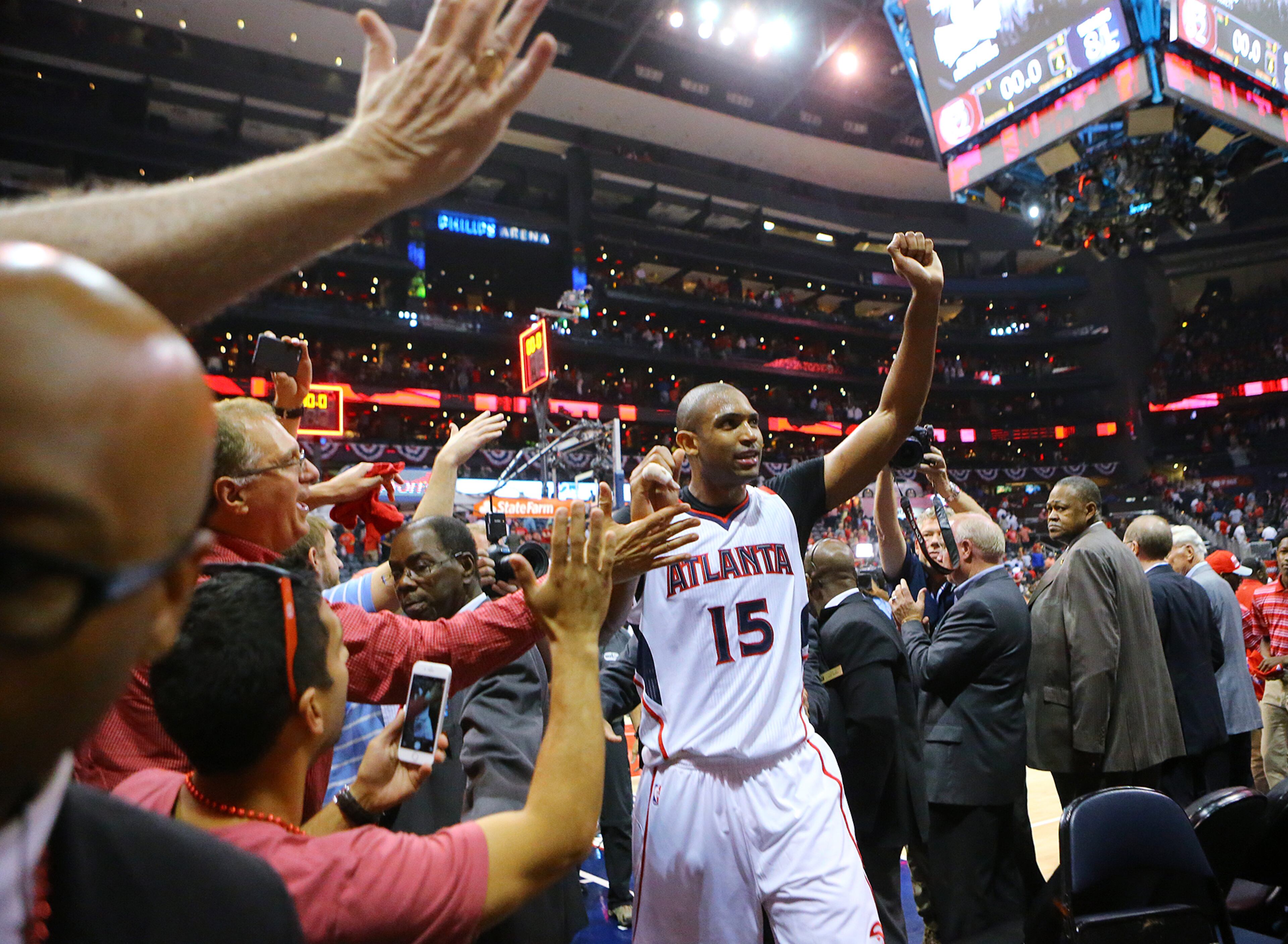 Al Horford acknowledges the cheering Hawks fans walking off the court after beating the Wizards 82-81 in their Eastern Conference Semifinals game 5 on Tuesday, May 13, 2015, in Atlanta. Curtis Compton / ccompton@ajc.com