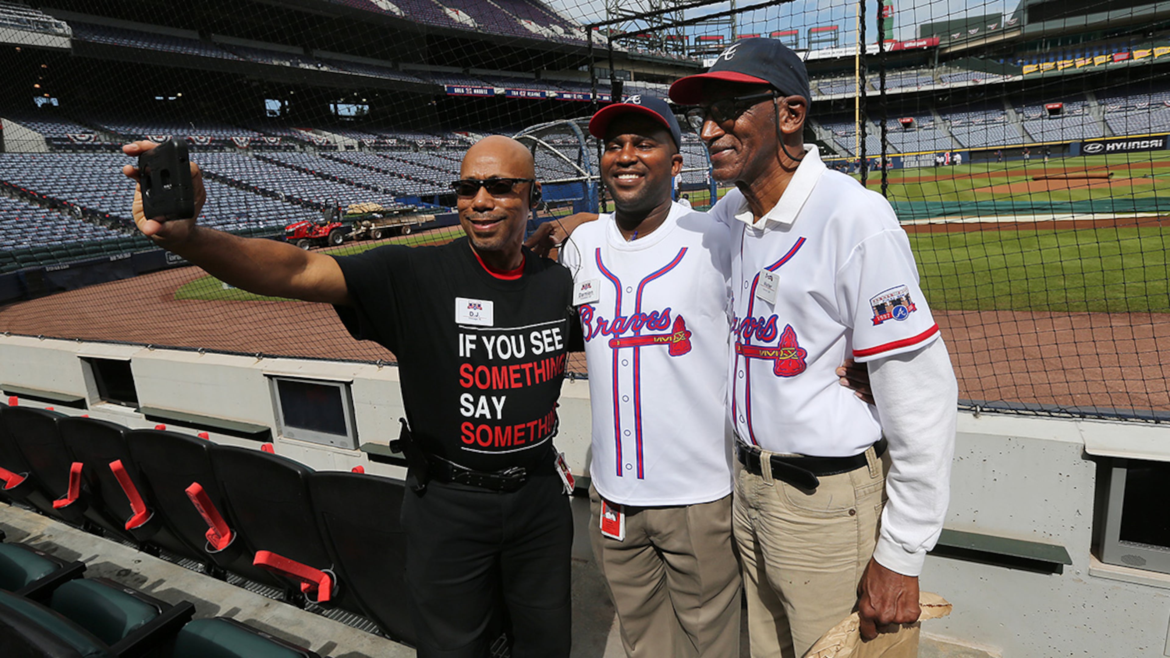 October 02, 2016 Atlanta: Security guard D.J. Johnson (from left) and ushers Damion Carpenter and Walter Banks snap a selfie while working the final Braves game at Turner Field on Sunday, Oct. 2, 2016, in Atlanta. Curtis Compton /ccompton@ajc.com