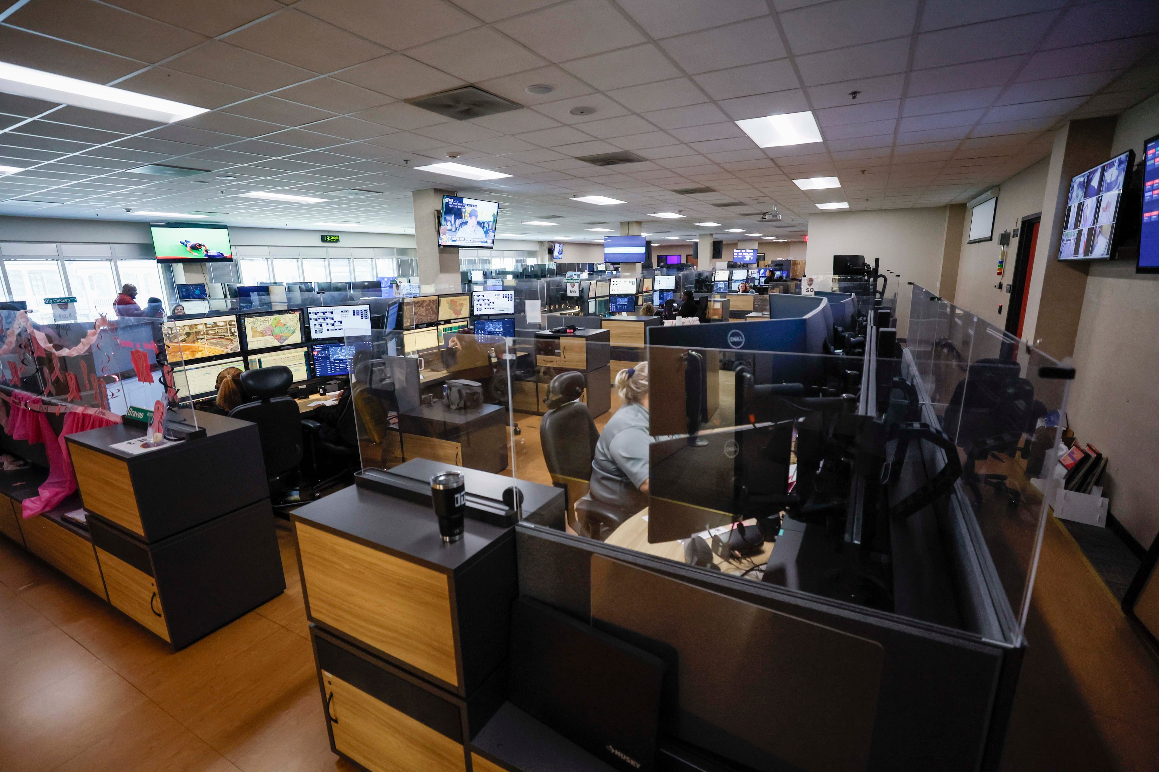 Dispatchers at the Cobb County 911 call center will eventually have a new facility. The Cobb County Commission in August approved almost $1.6 million to buy 12 acres of vacant land north of Powder Springs for a new 911 building. (Miguel Martinez/AJC)