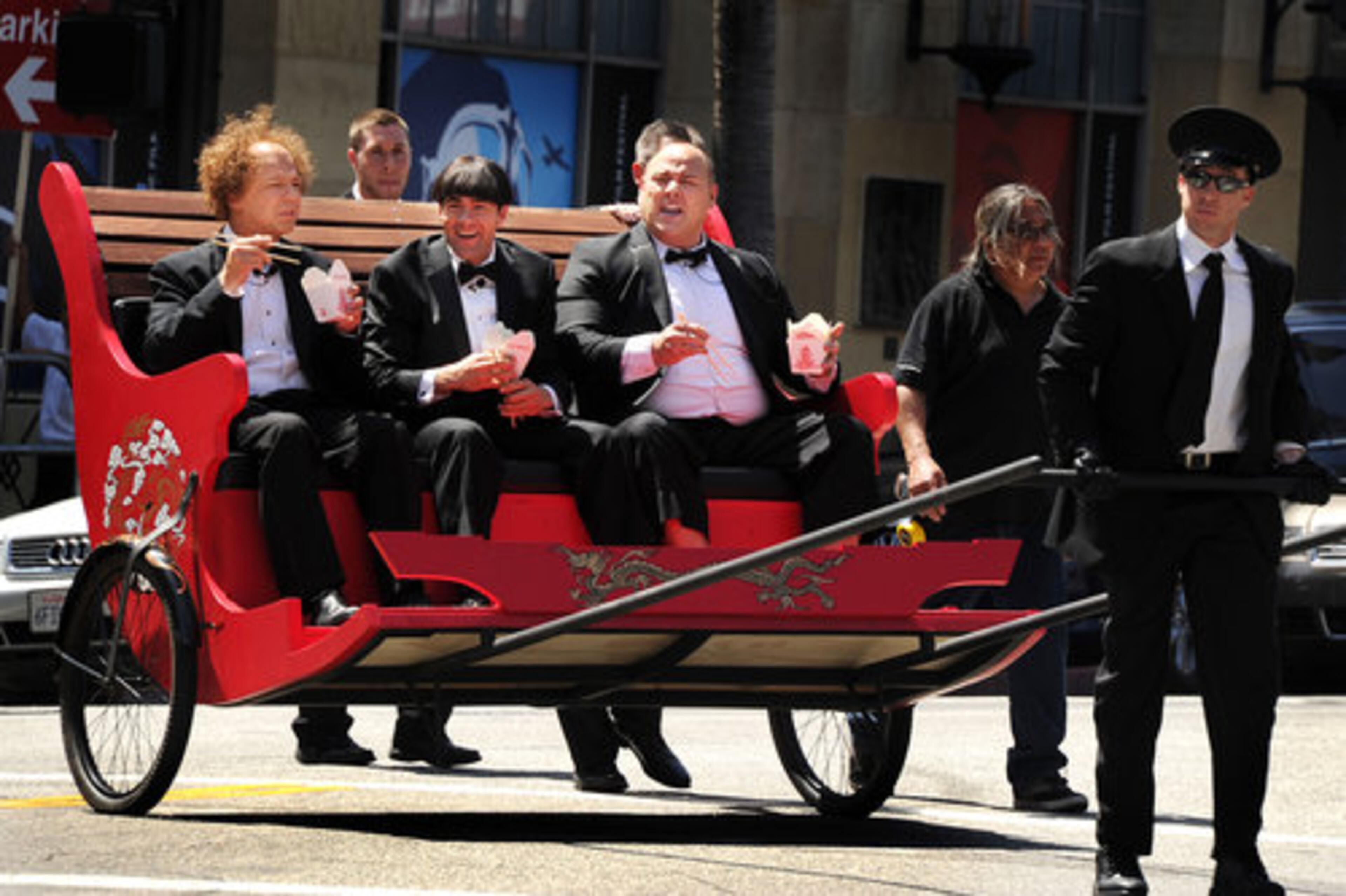 Actors Sean Hayes, left, Chris Diamantopoulos, center, and Will Sasso arrive in character at the premiere of "The Three Stooges: The Movie" at Grauman's Chinese Theatre in Los Angeles, Saturday, April 7, 2012.