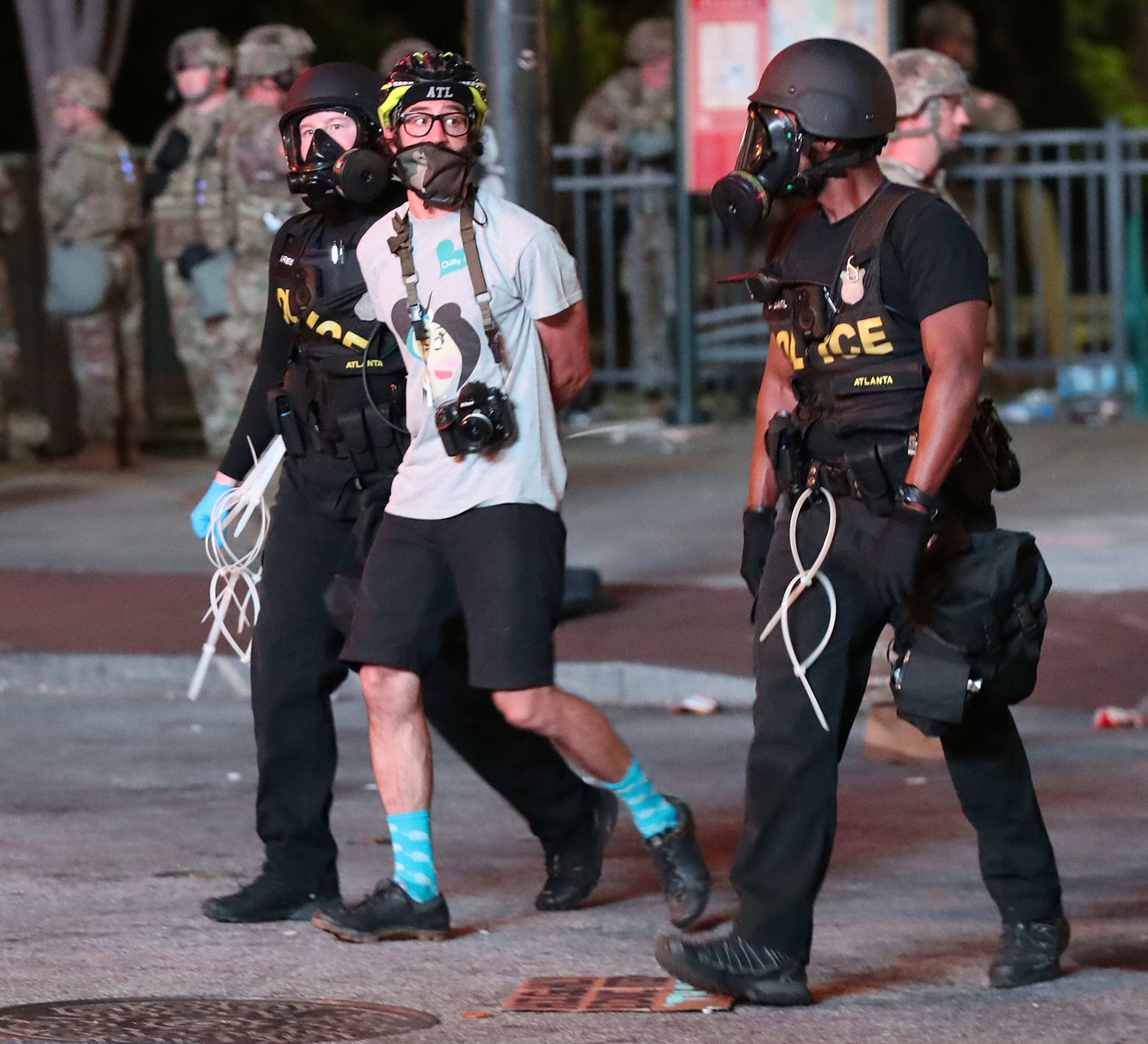 060120 Atlanta: A protesters is taken into custody after curfew during a fourth day of protests over the death of George Floyd on Monday, June 1, 2020, in Atlanta. Curtis Compton ccompton@ajc.com