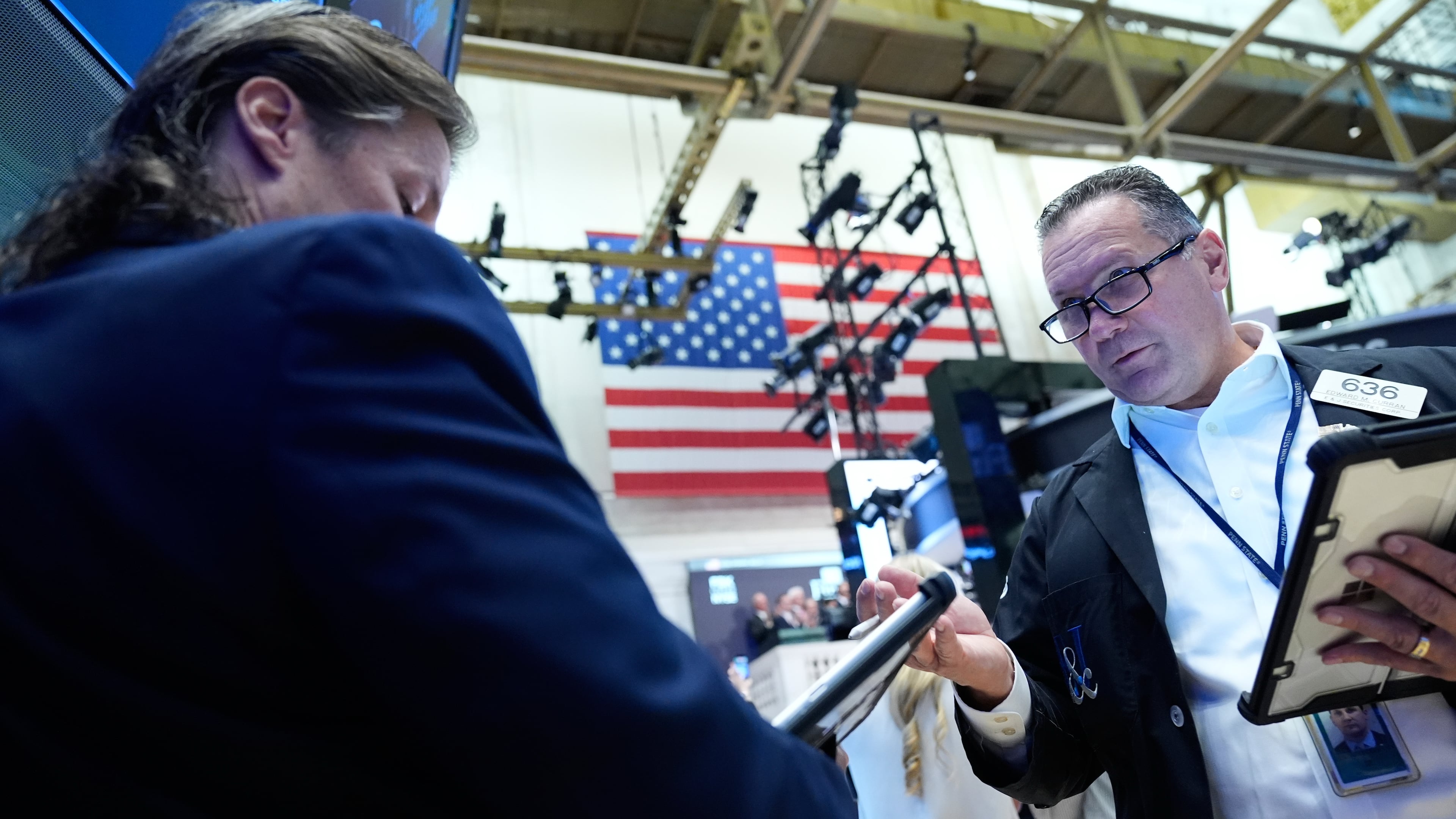 Edward Curran, right, works on the floor at the New York Stock Exchange in New York, Monday, Sept. 14, 2026. (AP Photo/Seth Wenig)