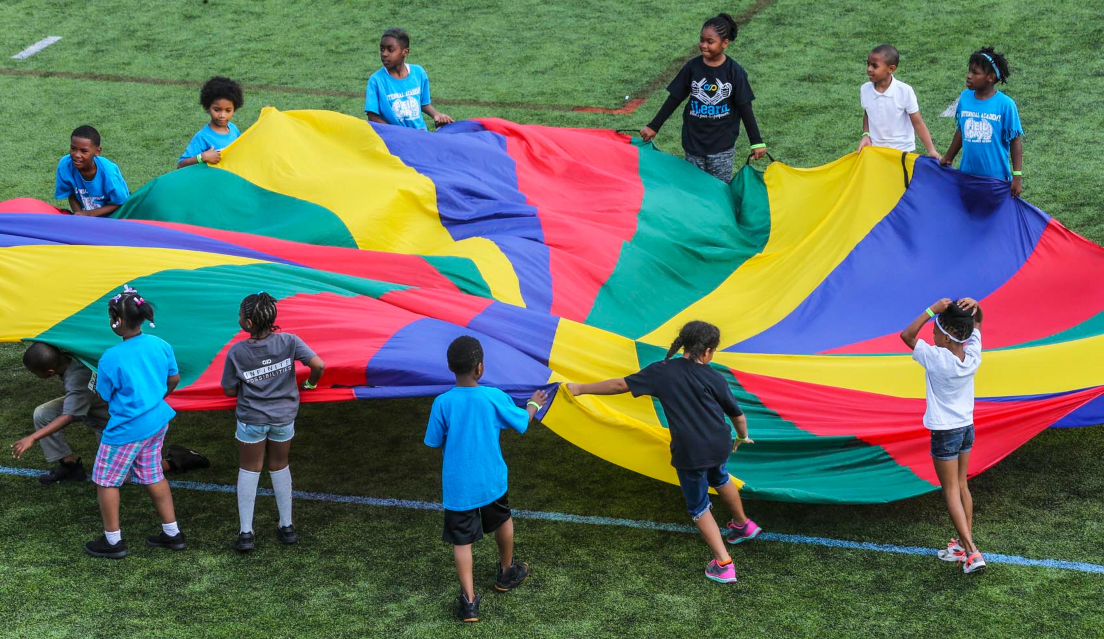 May 25, 2017 Atlanta: Centennial Academy second graders had their fun with a multi colored parachute during their Field Day events. The school year is starting to wind down as Centennial Academy in Atlanta held its Field Day Thursday, May 25, 2017 at nearby Georgia Tech. Centennial Academy located at 531 Luckie St NW, Atlanta partnerships with Georgia Tech in various capacities and held their event on The Roe Stamps Student Athletic Fields. Kindergarten through second grade had the morning followed by Third through Fifth grades in the afternoon. The middle schoolers get their day on Friday. JOHN SPINK/JSPINK@AJC.COM