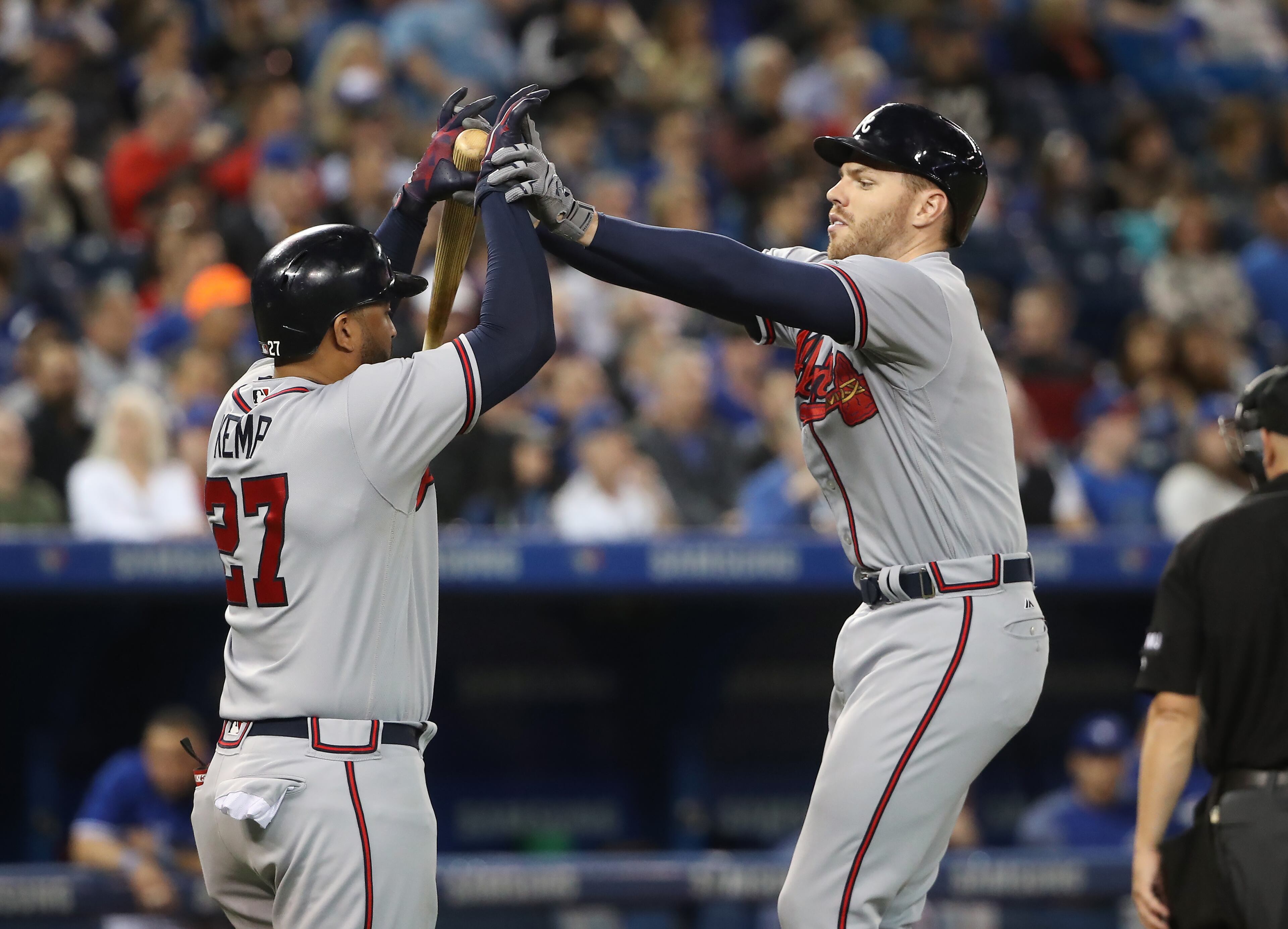 TORONTO, ON - MAY 16: Freddie Freeman #5 of the Atlanta Braves is congratulated by Matt Kemp #27 after hitting a two-run home run in the fifth inning during MLB game action against the Toronto Blue Jays at Rogers Centre on May 16, 2017 in Toronto, Canada. (Photo by Tom Szczerbowski/Getty Images)