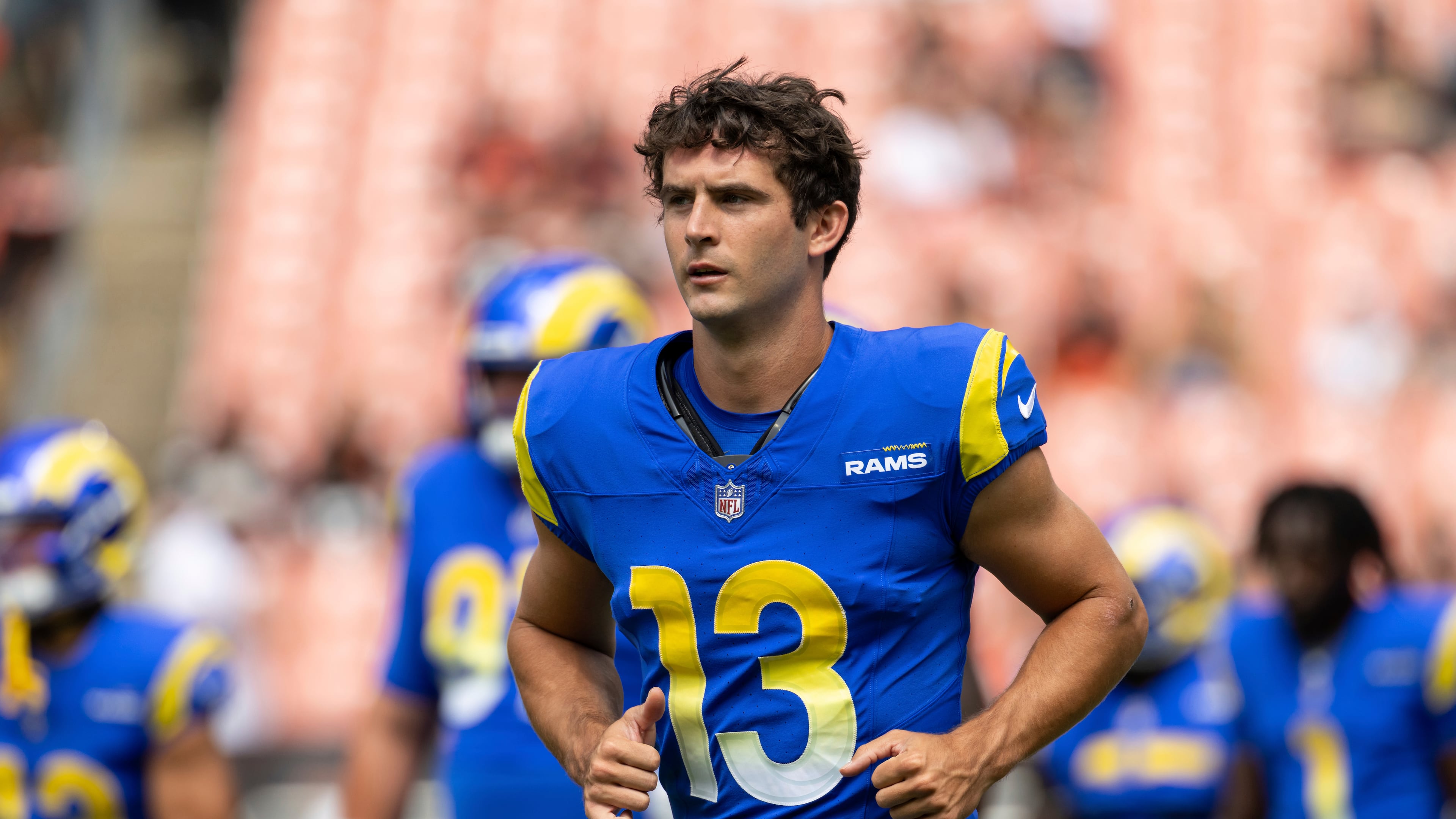 Los Angeles Rams quarterback Stetson Bennett IV runs off the field on Saturday, Aug. 23, 2025, in Cleveland. Bennett has been working in the Rams’ system, which is similar to the Falcons’. (Matt Durisko/AP)