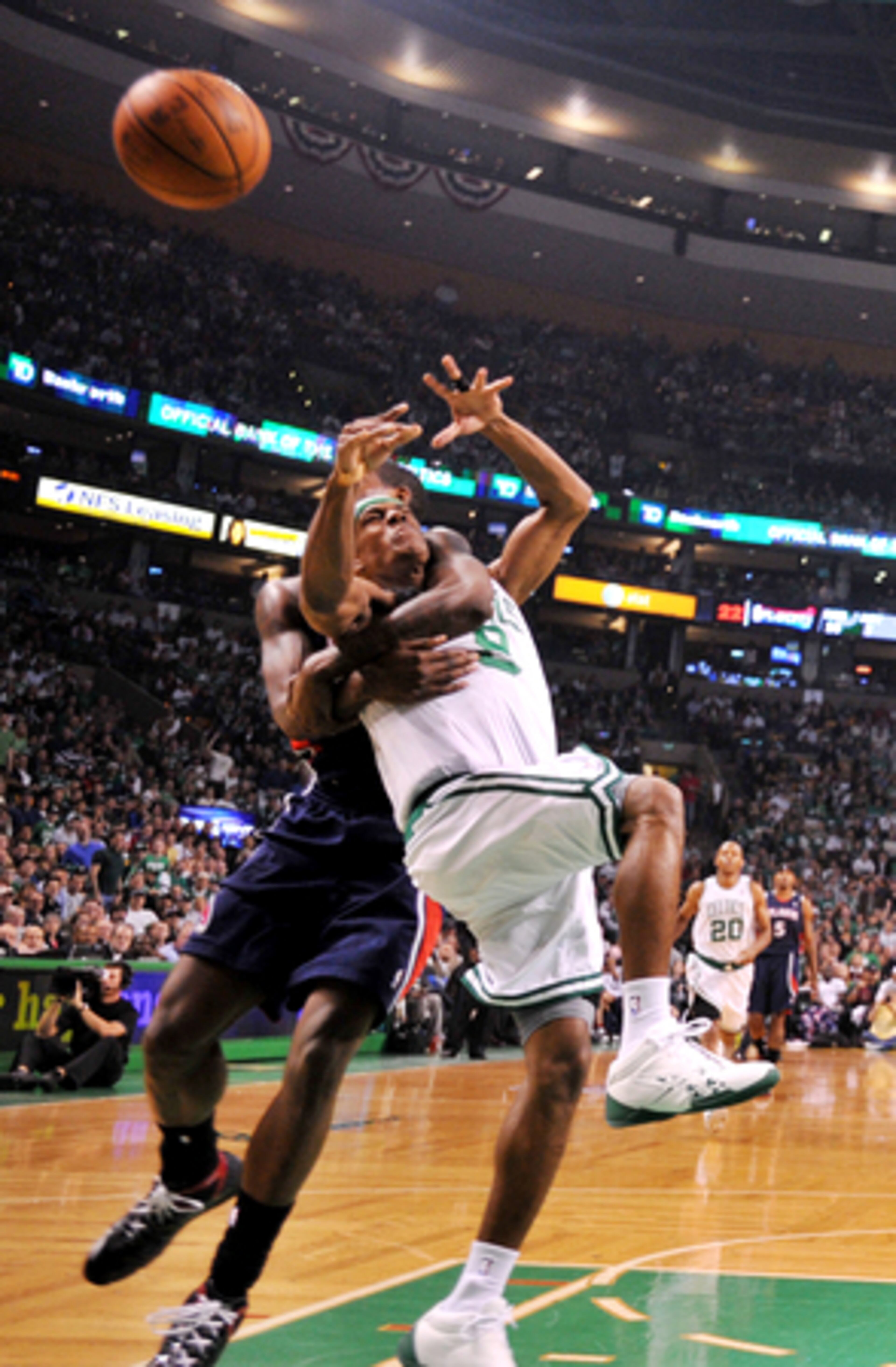 Ball comes flying out as Rondo jumps into Williams' arms.